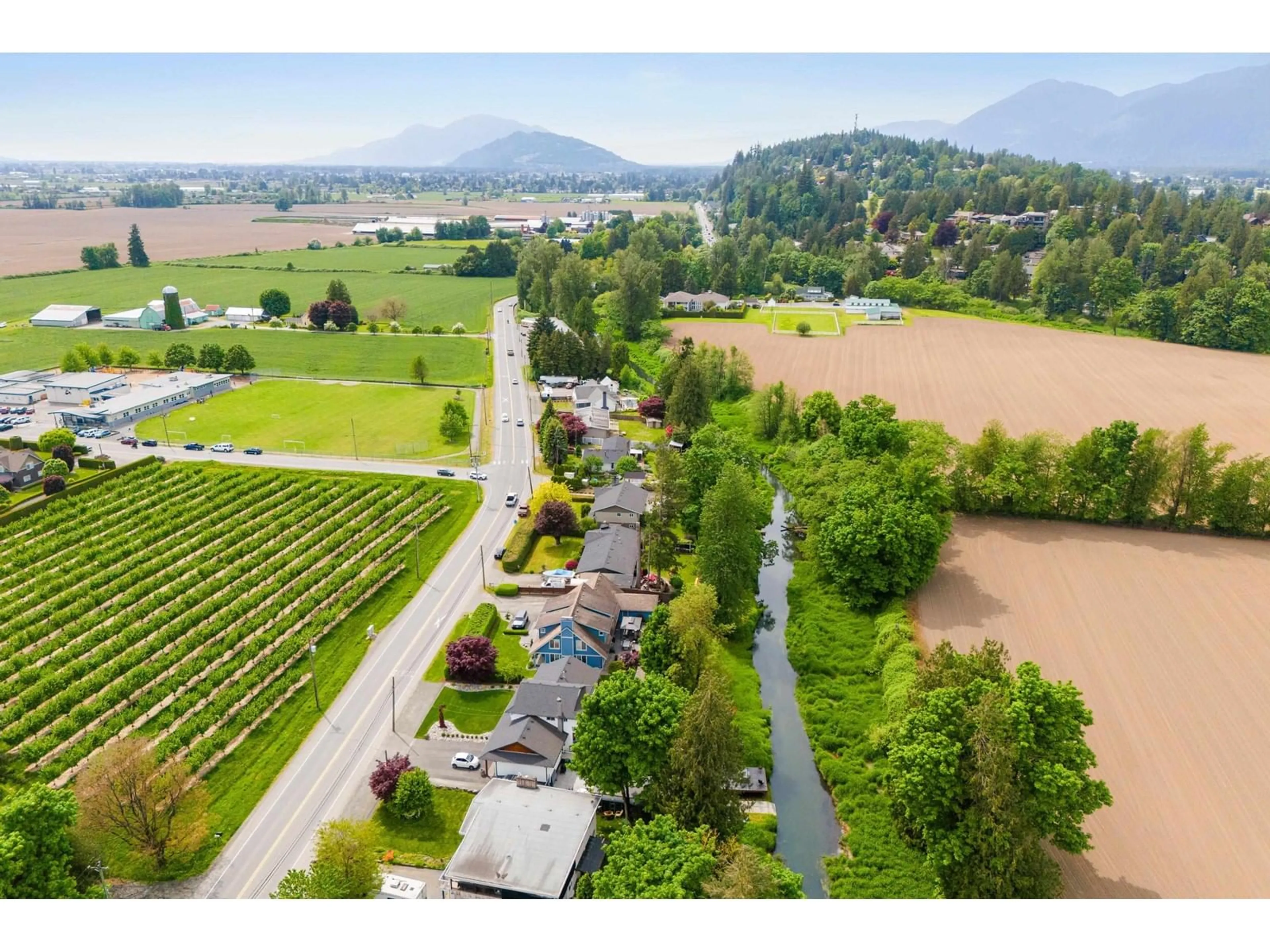 A pic from outside/outdoor area/front of a property/back of a property/a pic from drone, mountain view for 48125 YALE ROAD, Chilliwack British Columbia V4Z0A8