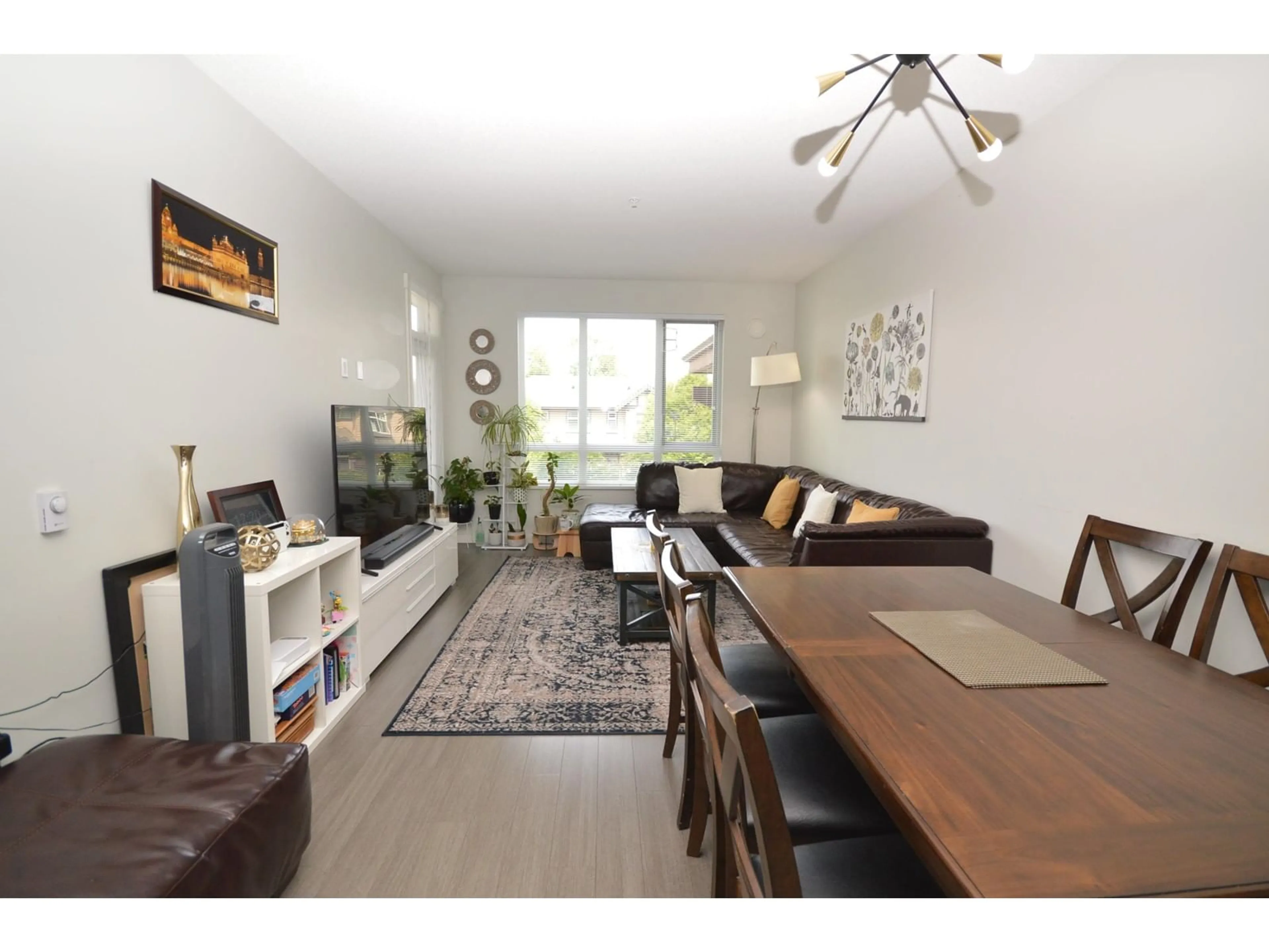 Living room with furniture, wood/laminate floor for 219 - 31158 WESTRIDGE, Abbotsford British Columbia V2T0K5