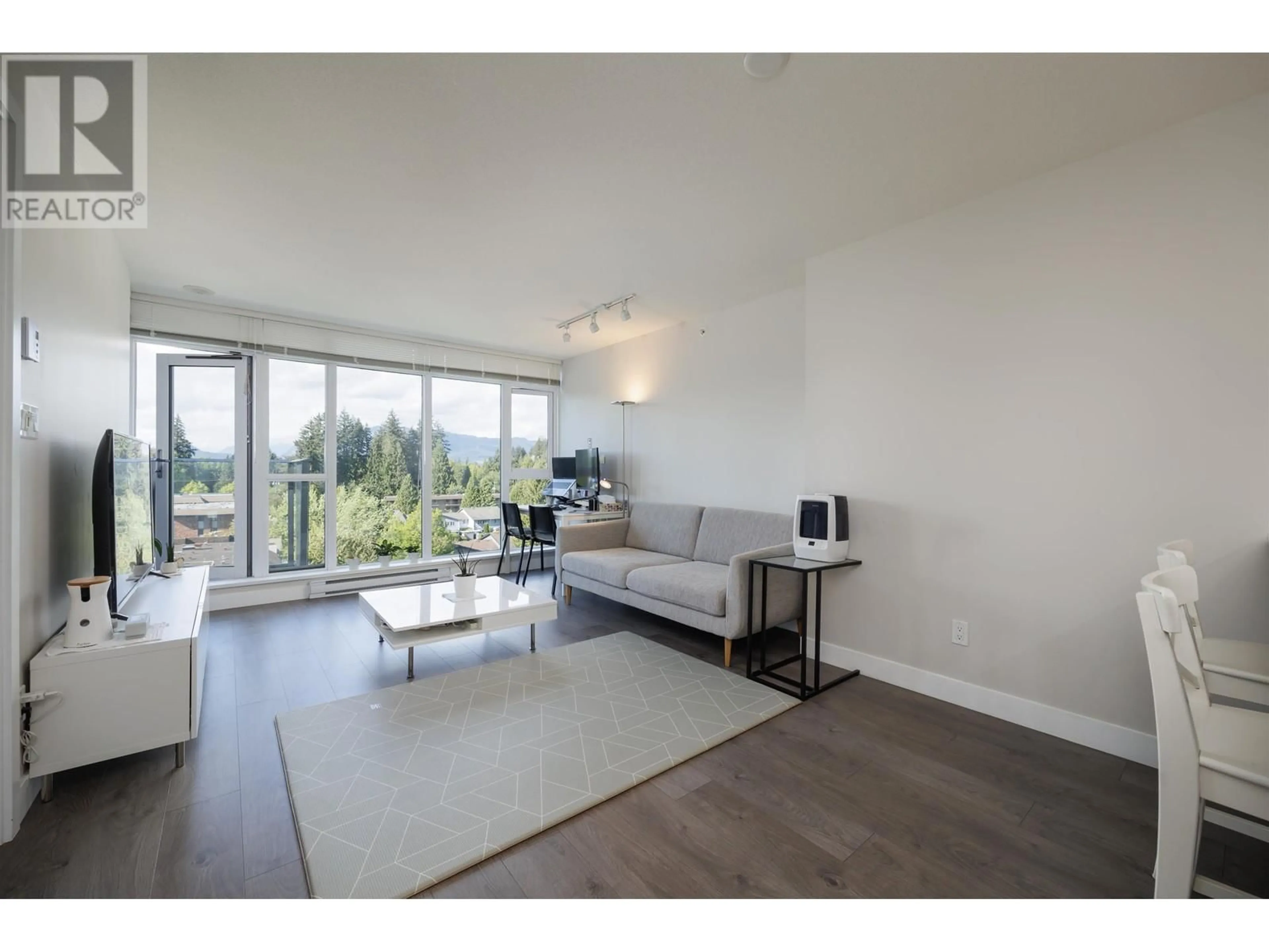 Living room with furniture, wood/laminate floor for 1006 - 958 RIDGEWAY AVENUE, Coquitlam British Columbia V3K0C5