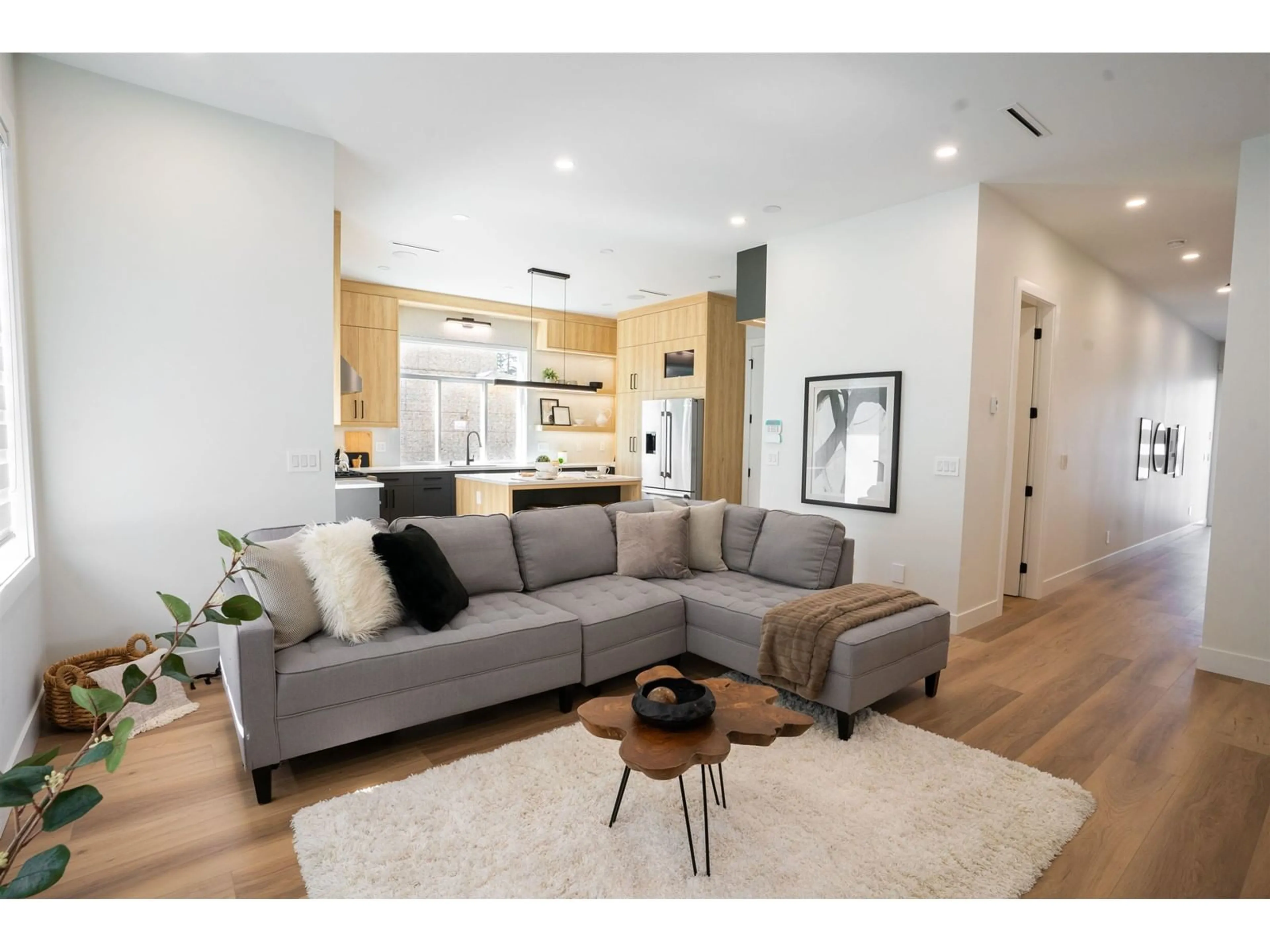 Living room with furniture, wood/laminate floor for 7530 205A, Langley British Columbia V2Y1V5