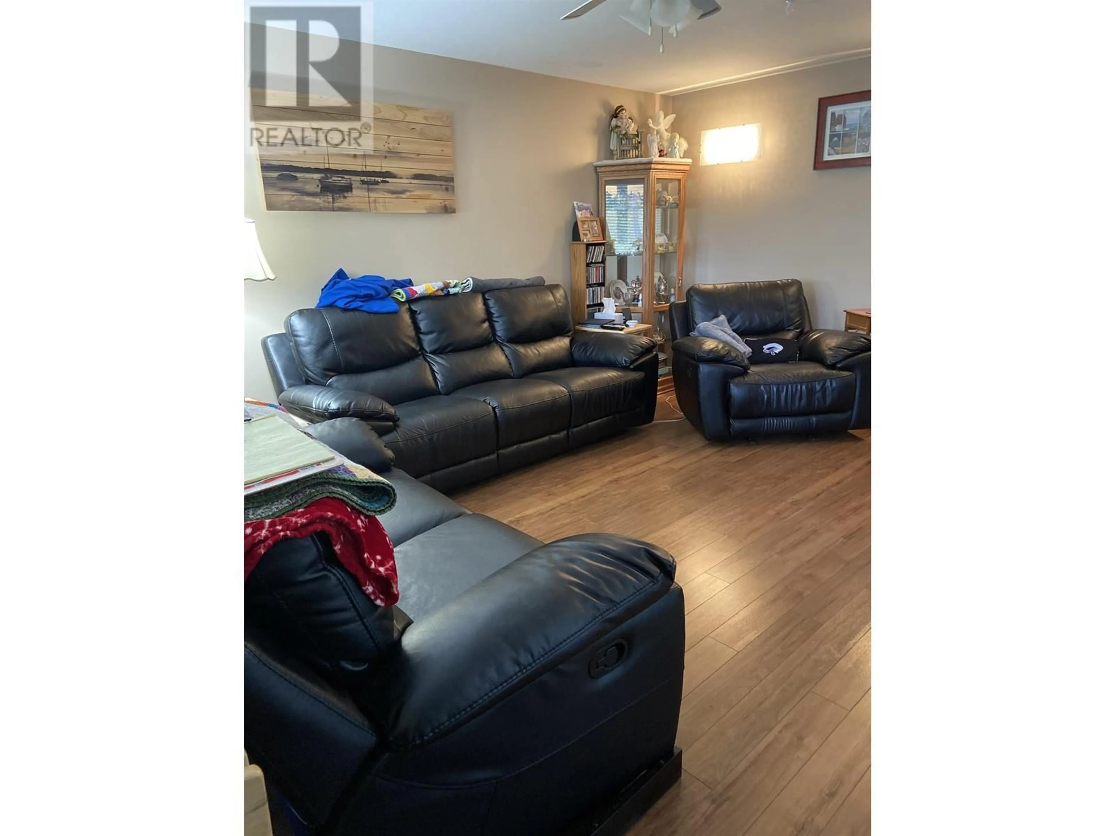Living room with furniture, wood/laminate floor for 4832 GRAHAM AVENUE, Terrace British Columbia V8G1B2