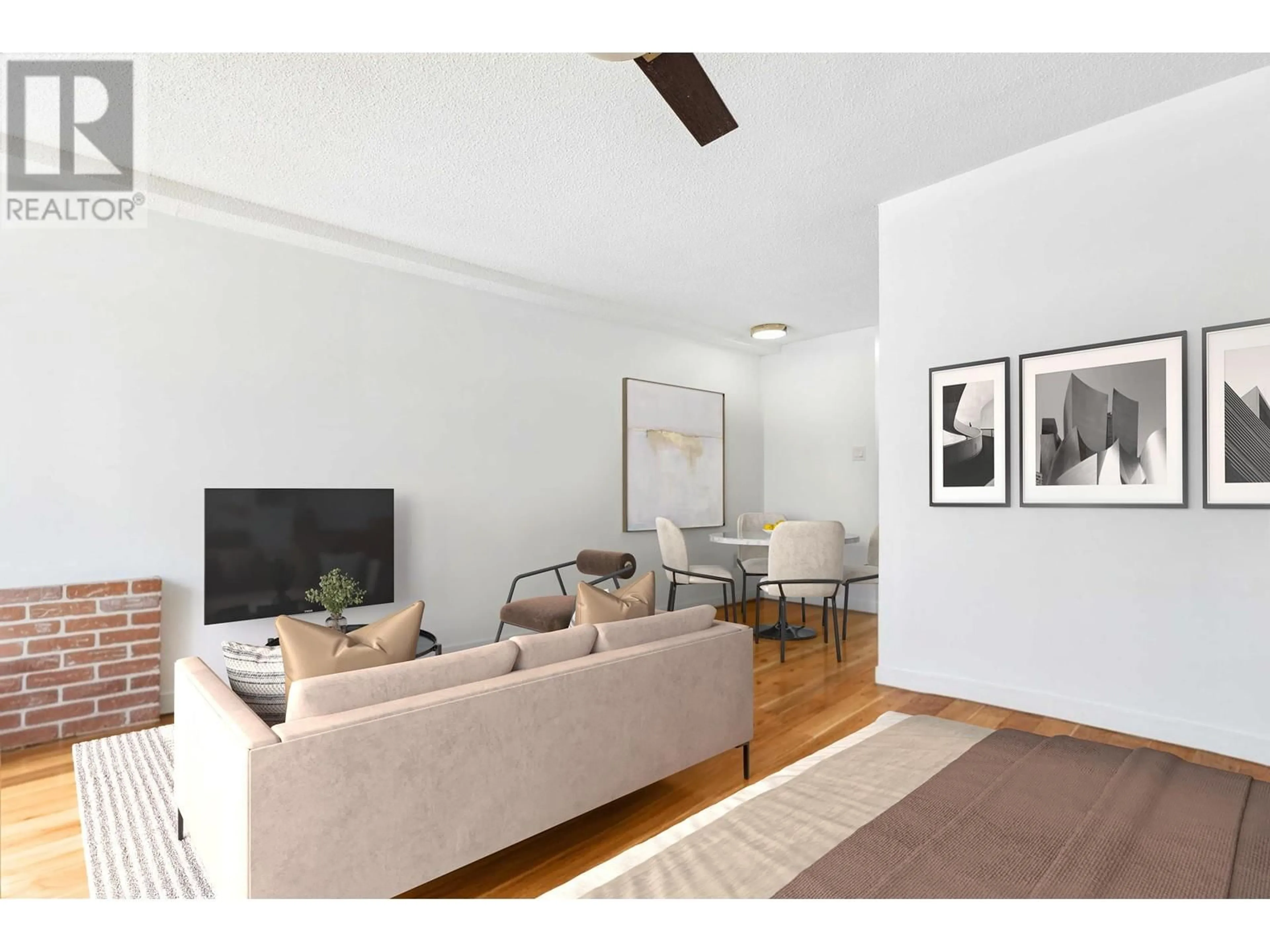Living room with furniture, wood/laminate floor for 101 - 222 TEMPLETON DRIVE, Vancouver British Columbia V5L3E4