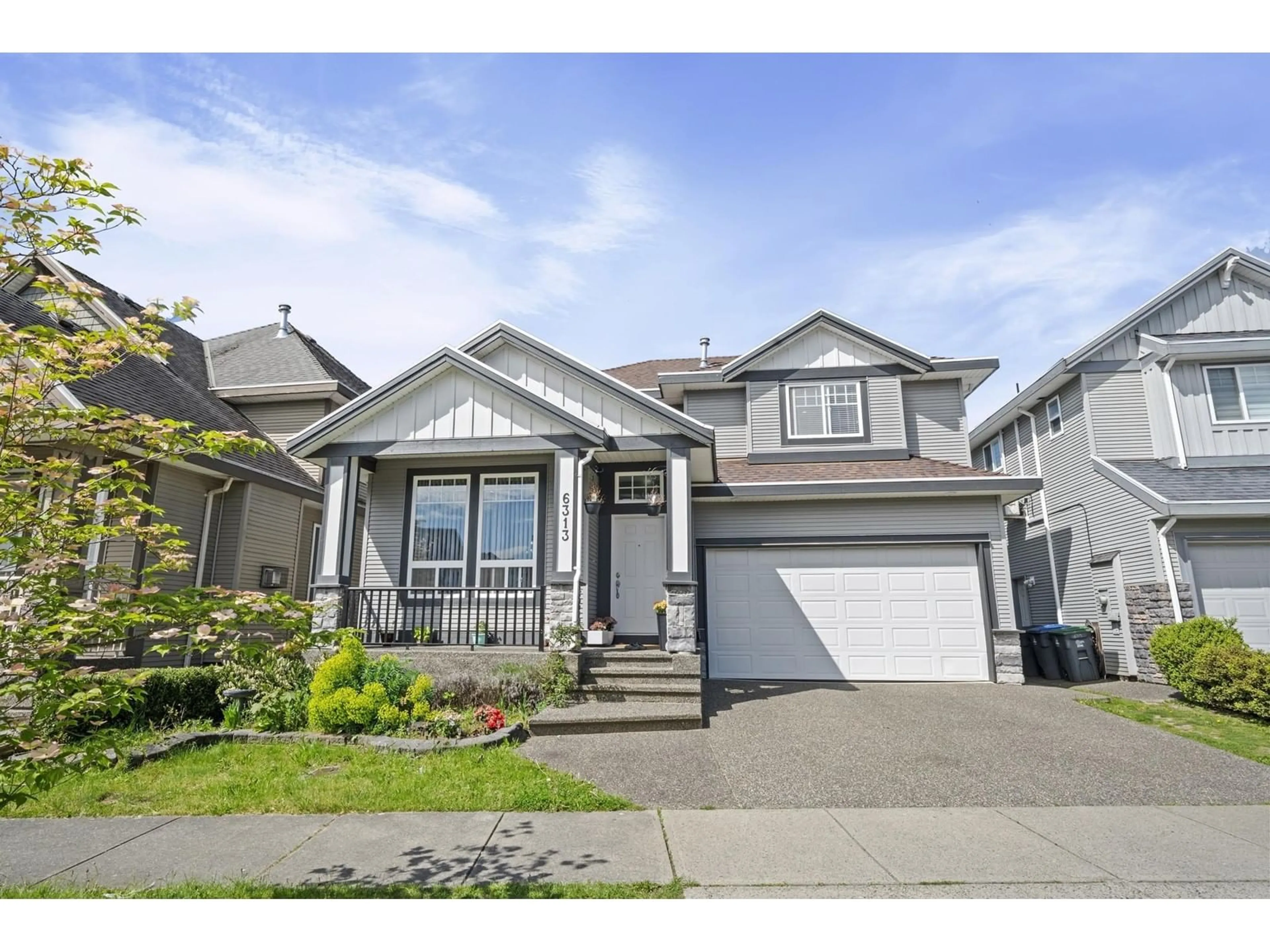 Home with vinyl exterior material, street for 6313 167B, Surrey British Columbia V3S1X3