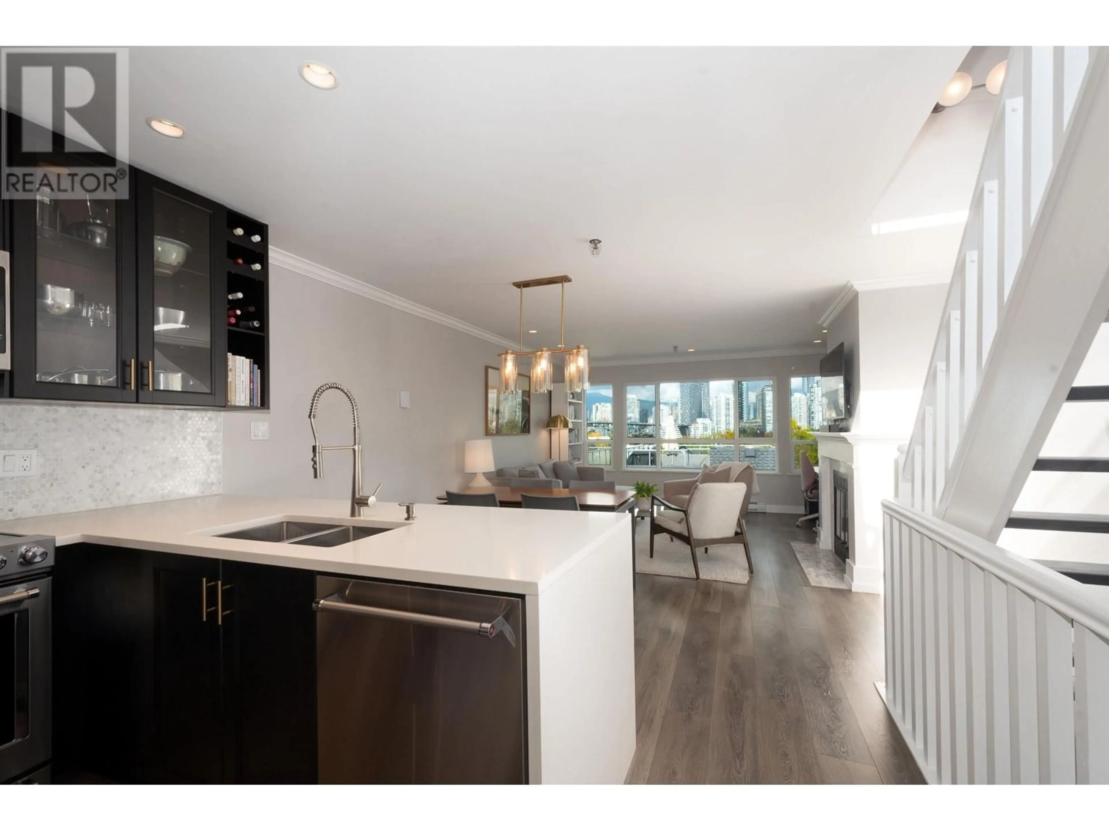 Open concept kitchen, wood/laminate floor for 307 - 1166 6TH AVENUE, Vancouver British Columbia V6H1A4