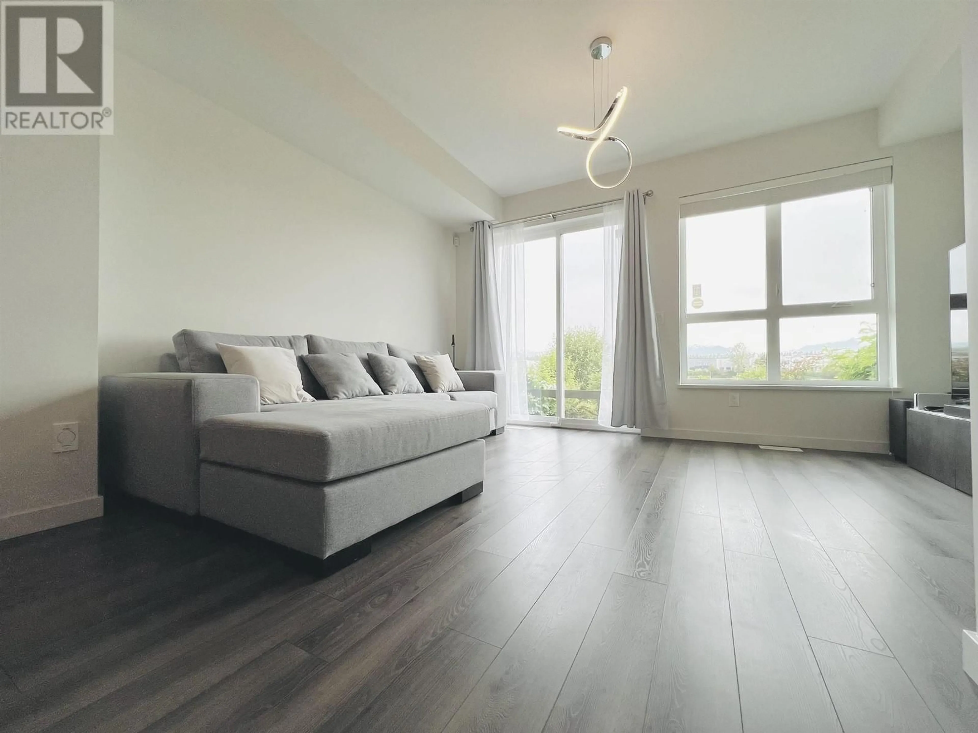 Living room with furniture, wood/laminate floor for 49 - 10311 RIVER DRIVE, Richmond British Columbia V6X0T2