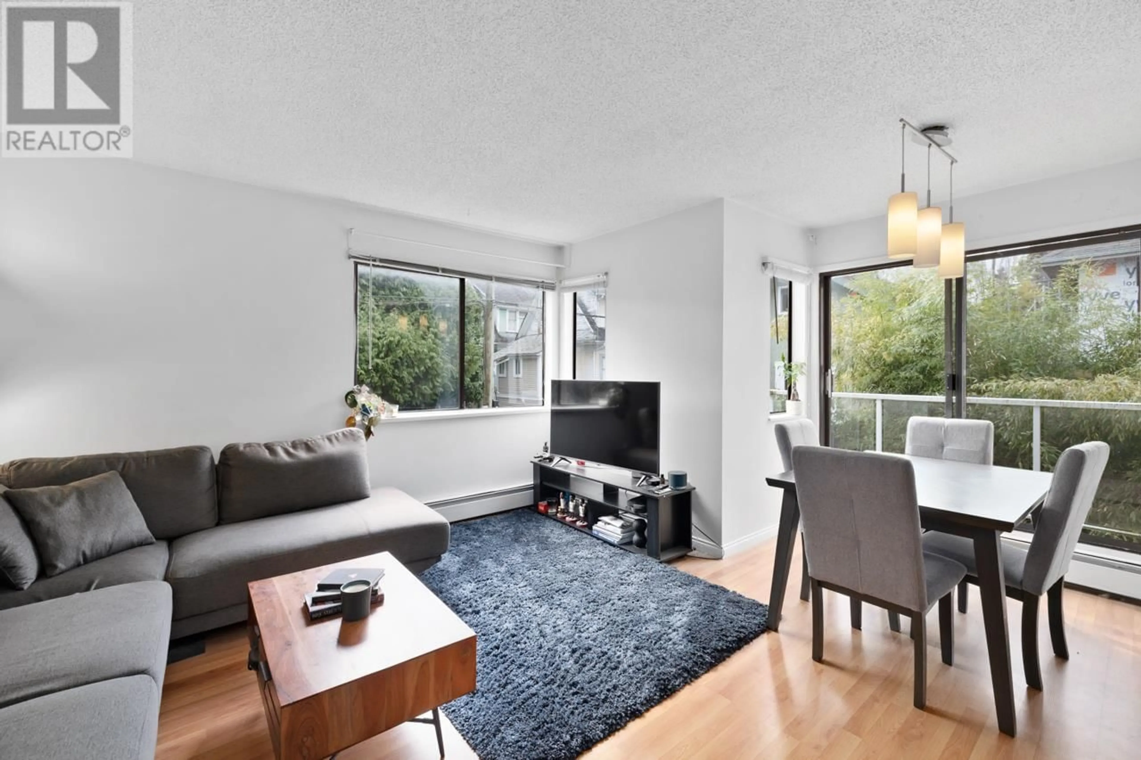 Living room with furniture, wood/laminate floor for 315 - 830 7TH AVENUE, Vancouver British Columbia V5T4J2
