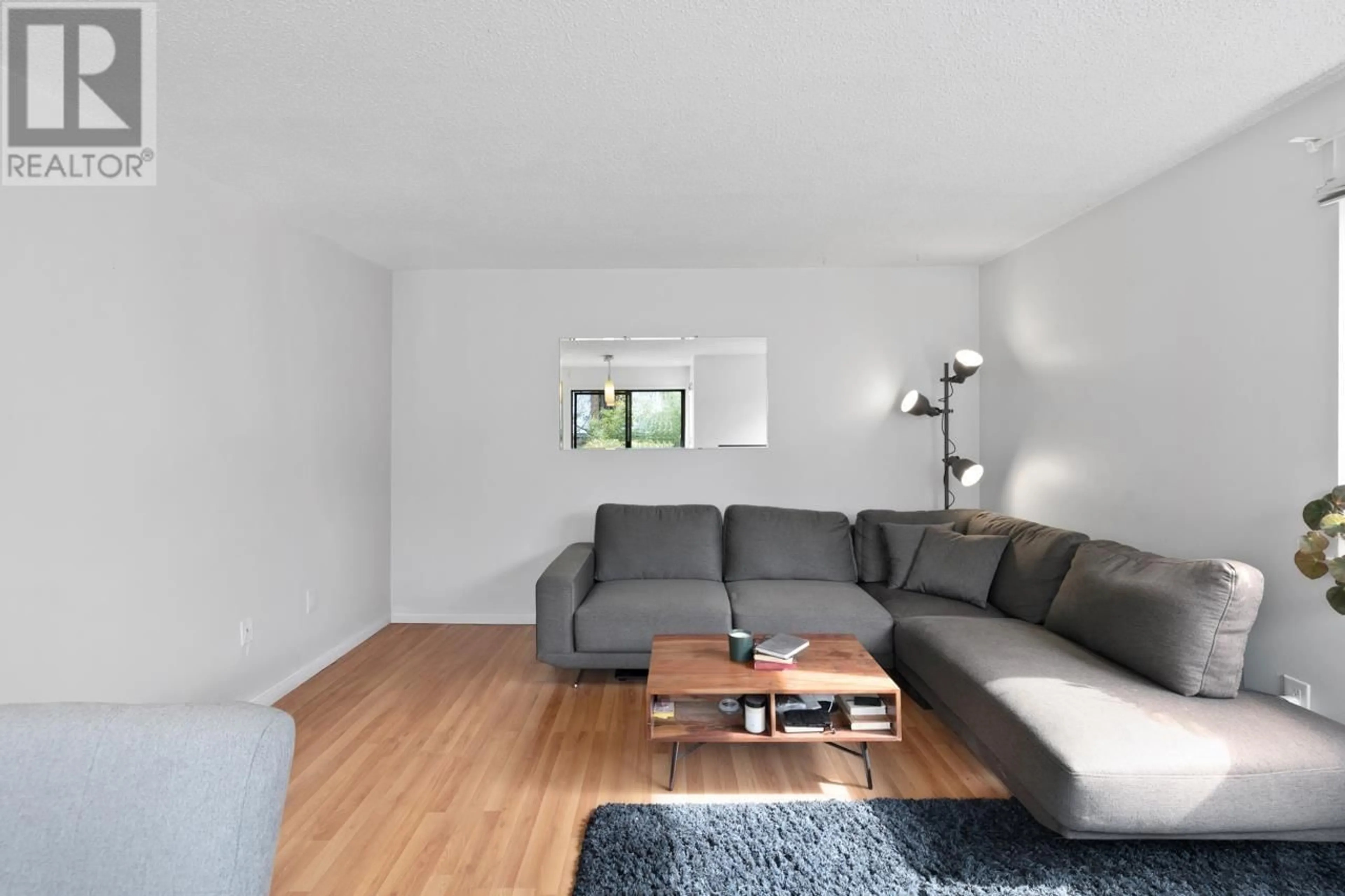 Living room with furniture, wood/laminate floor for 315 - 830 7TH AVENUE, Vancouver British Columbia V5T4J2