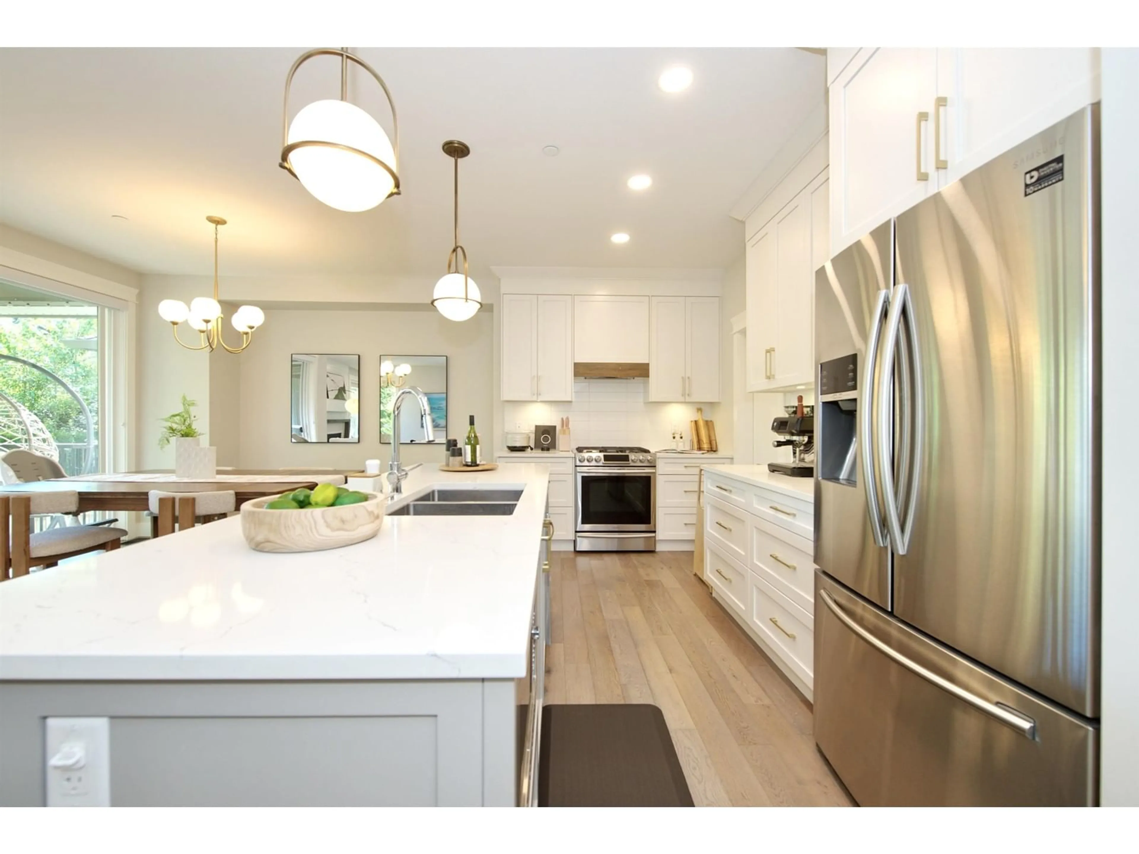Open concept kitchen, wood/laminate floor for 107 - 8217 204B, Langley British Columbia V2Y0Z8