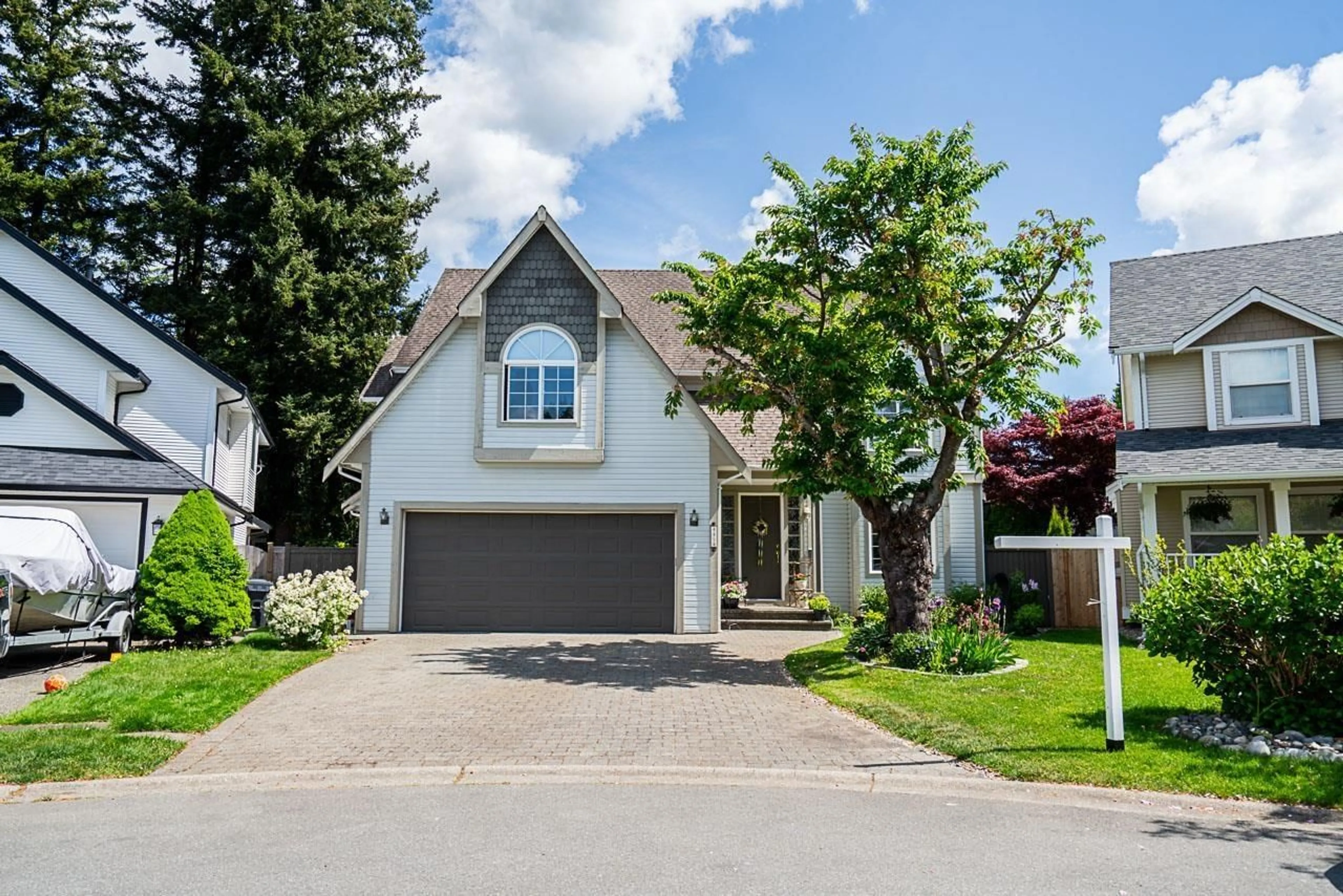 Home with vinyl exterior material, street for 4454 209B, Langley British Columbia V3A8Y8