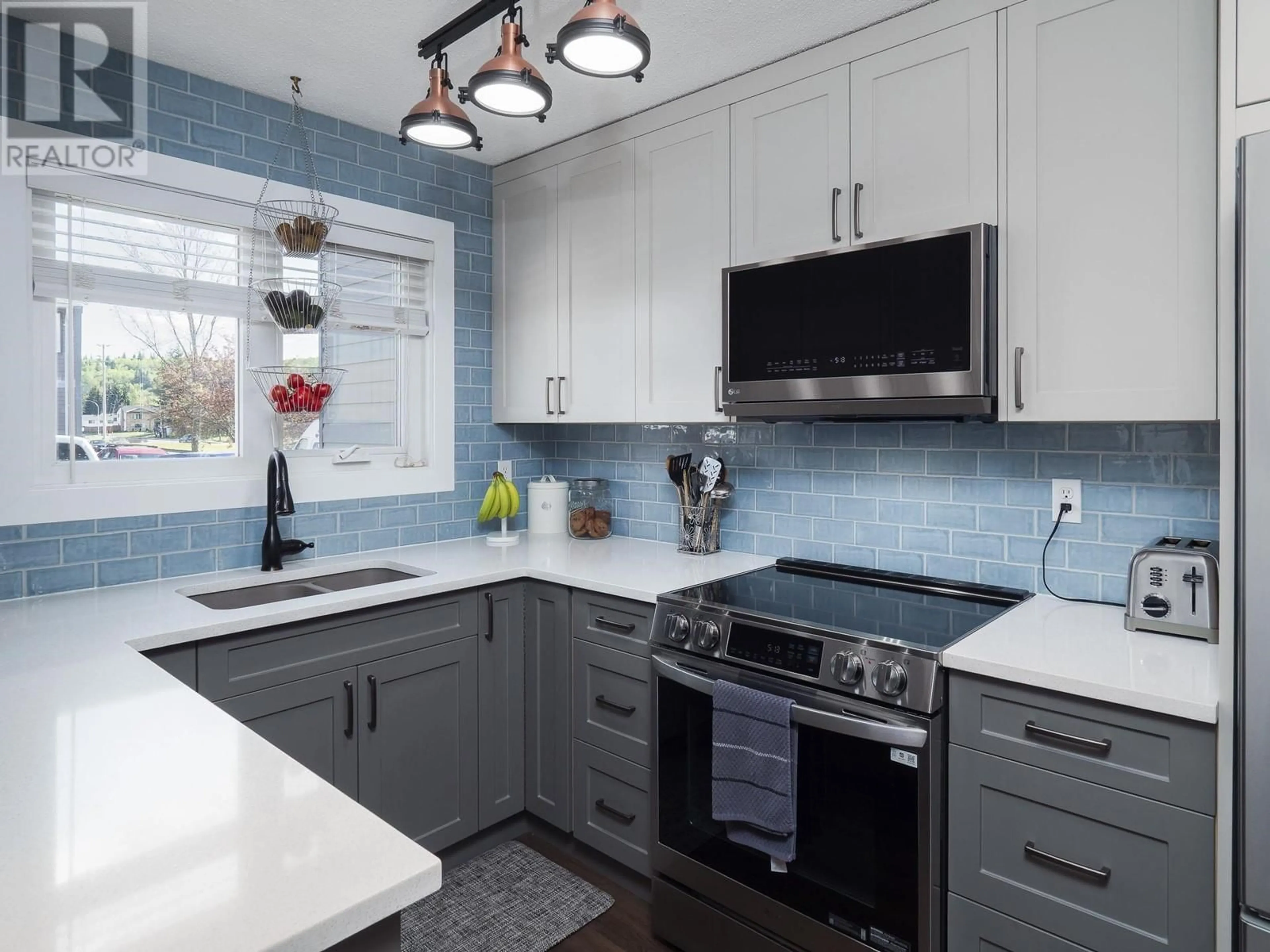 Contemporary kitchen, ceramic/tile floor for 317 - 2550 OSPIKA BOULEVARD, Prince George British Columbia V2N3T2