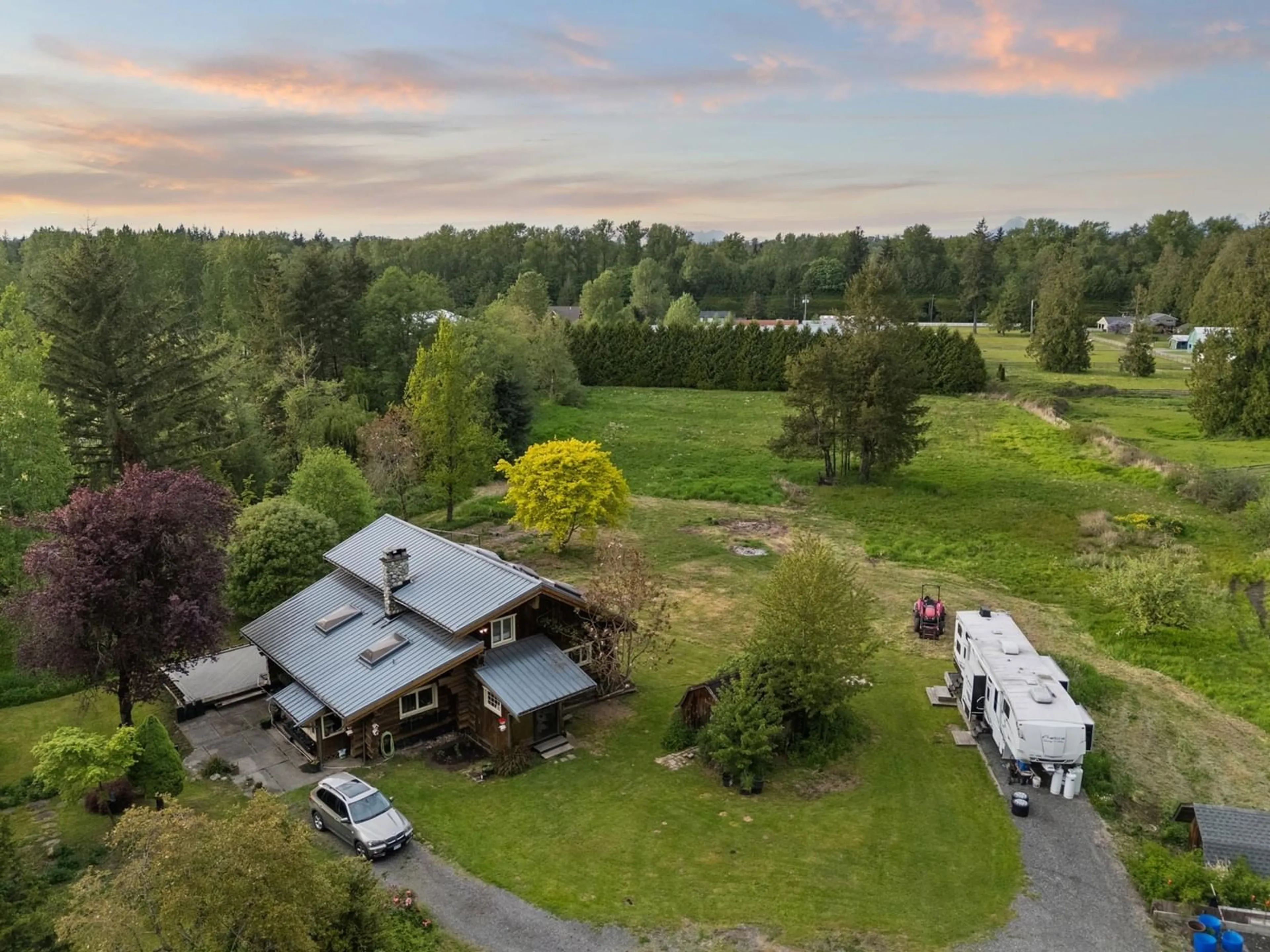 A pic from outside/outdoor area/front of a property/back of a property/a pic from drone, unknown for 21411 2, Langley British Columbia V3A2V3