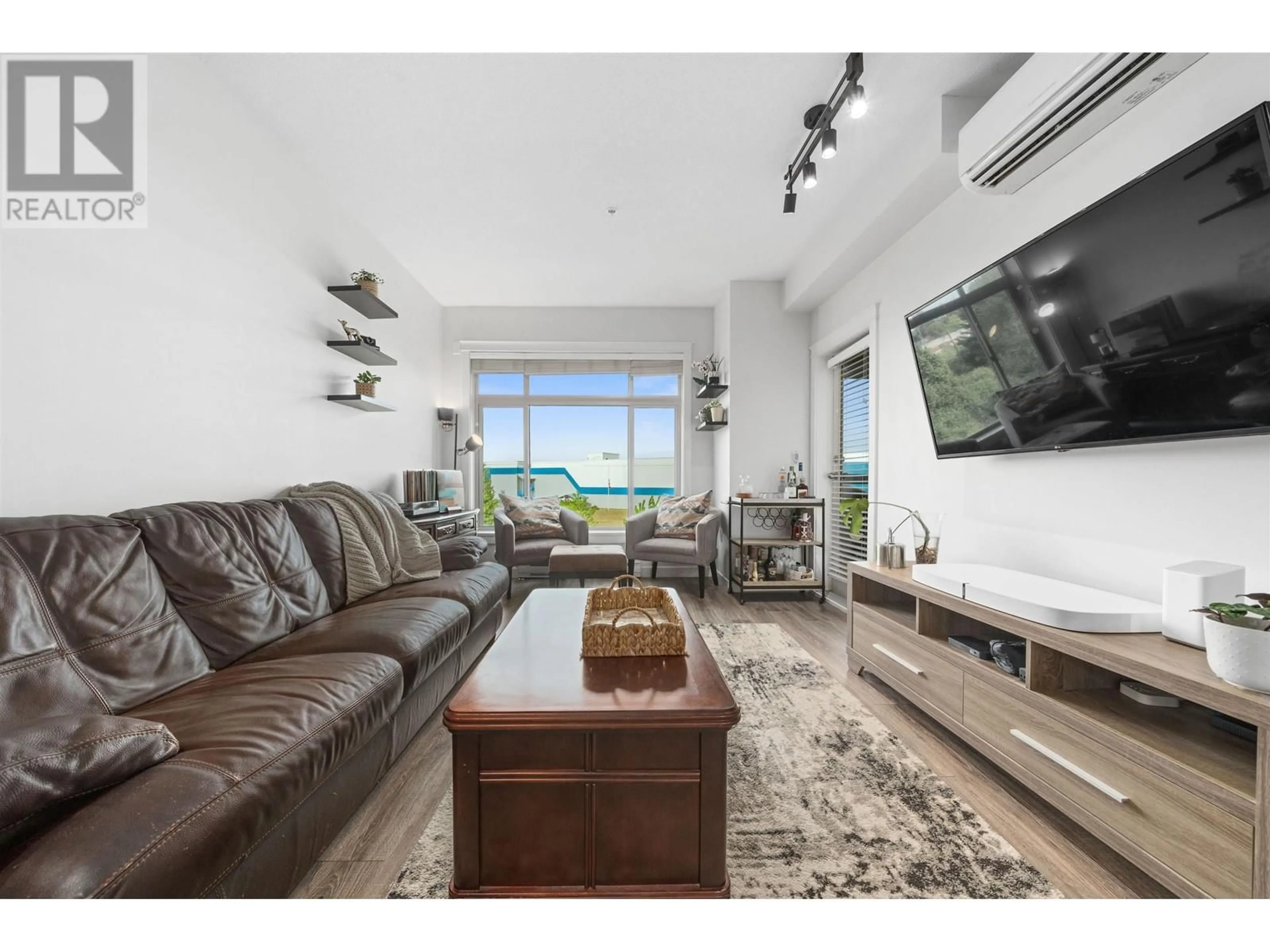 Living room with furniture, wood/laminate floor for 313 - 12635 190A STREET, Pitt Meadows British Columbia V3Y0E8