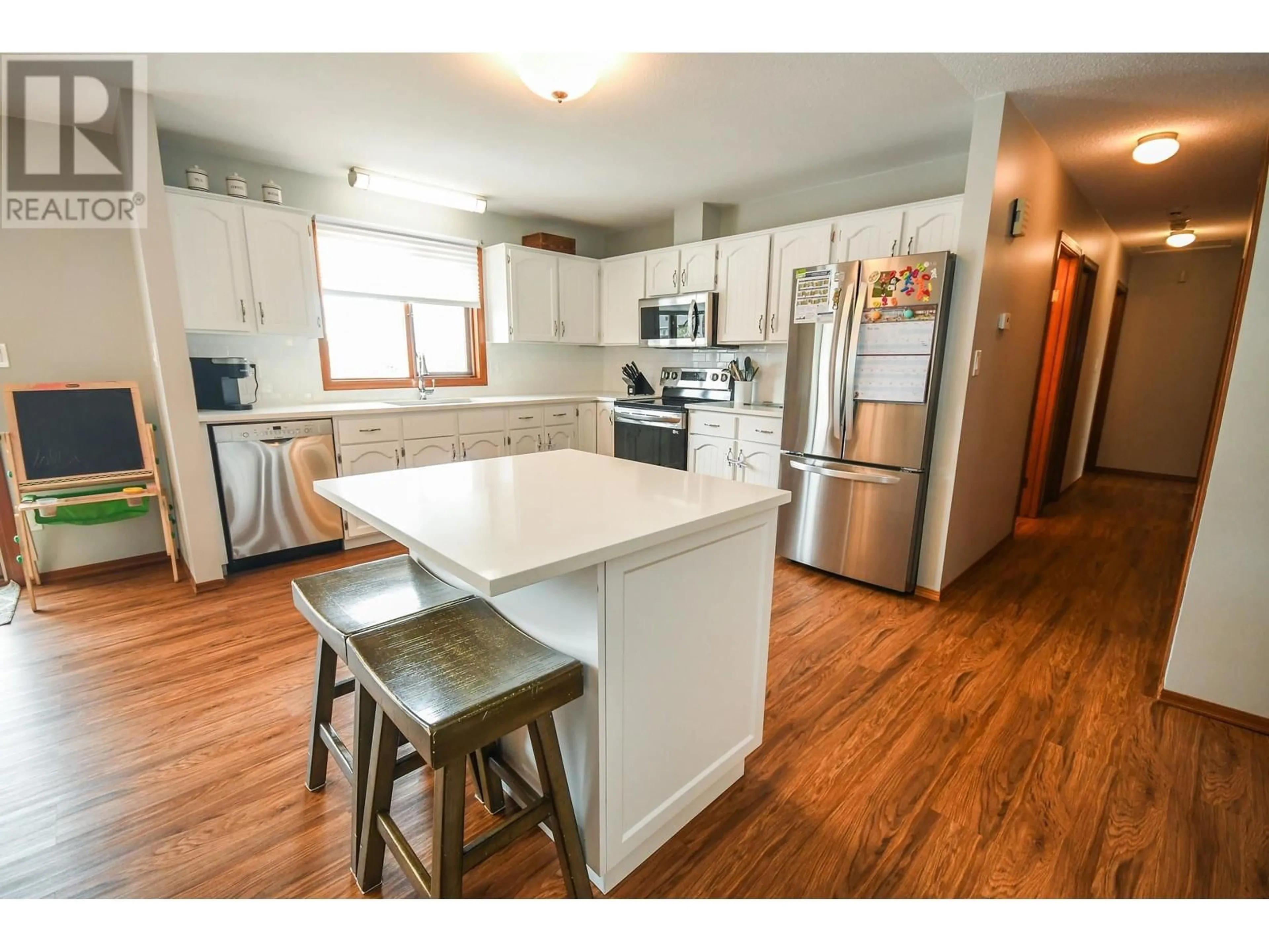 Open concept kitchen, wood/laminate floor for 2904 CHRISTOPHER CRESCENT, Prince George British Columbia V2N4S4