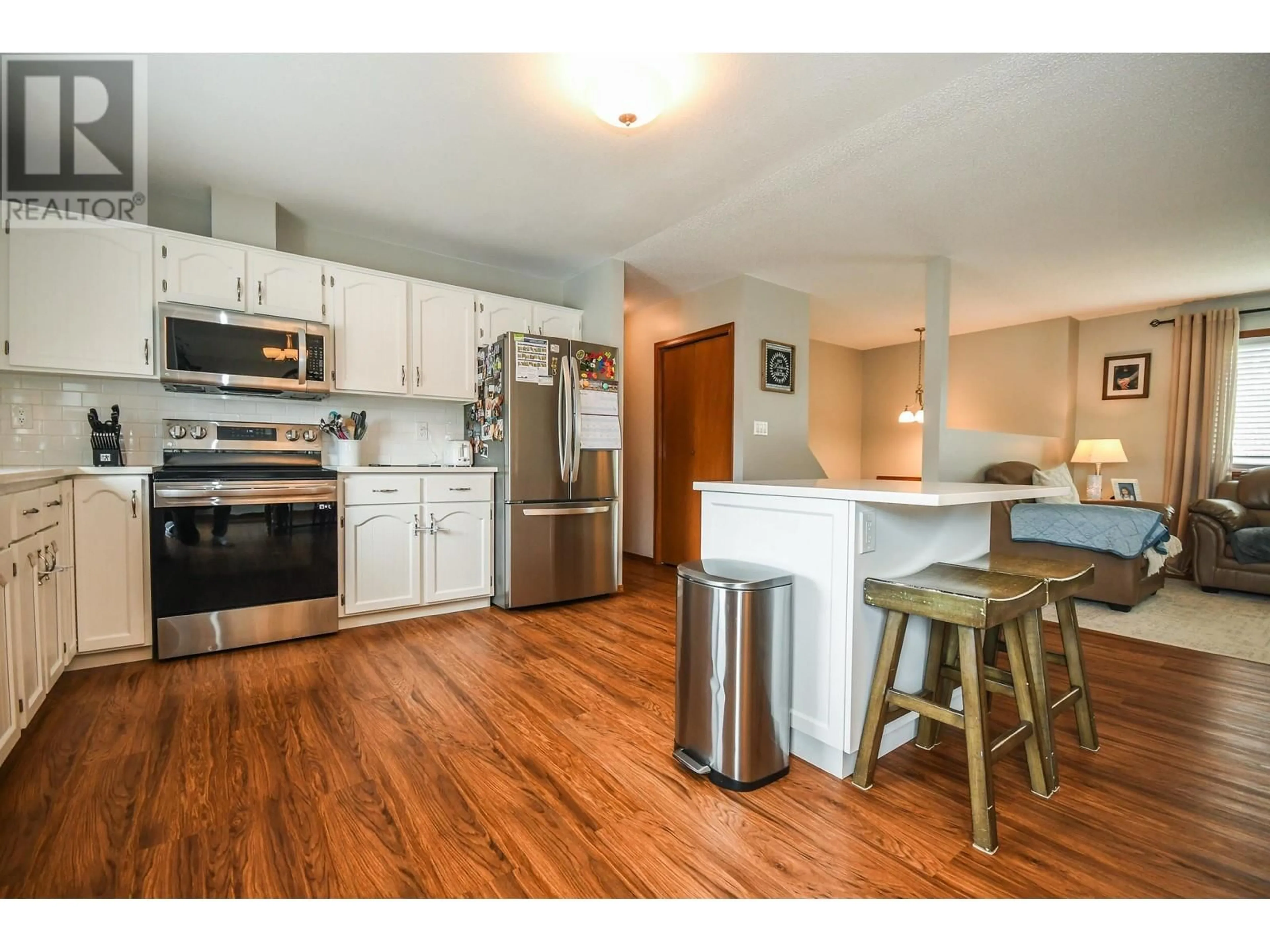 Open concept kitchen, wood/laminate floor for 2904 CHRISTOPHER CRESCENT, Prince George British Columbia V2N4S4