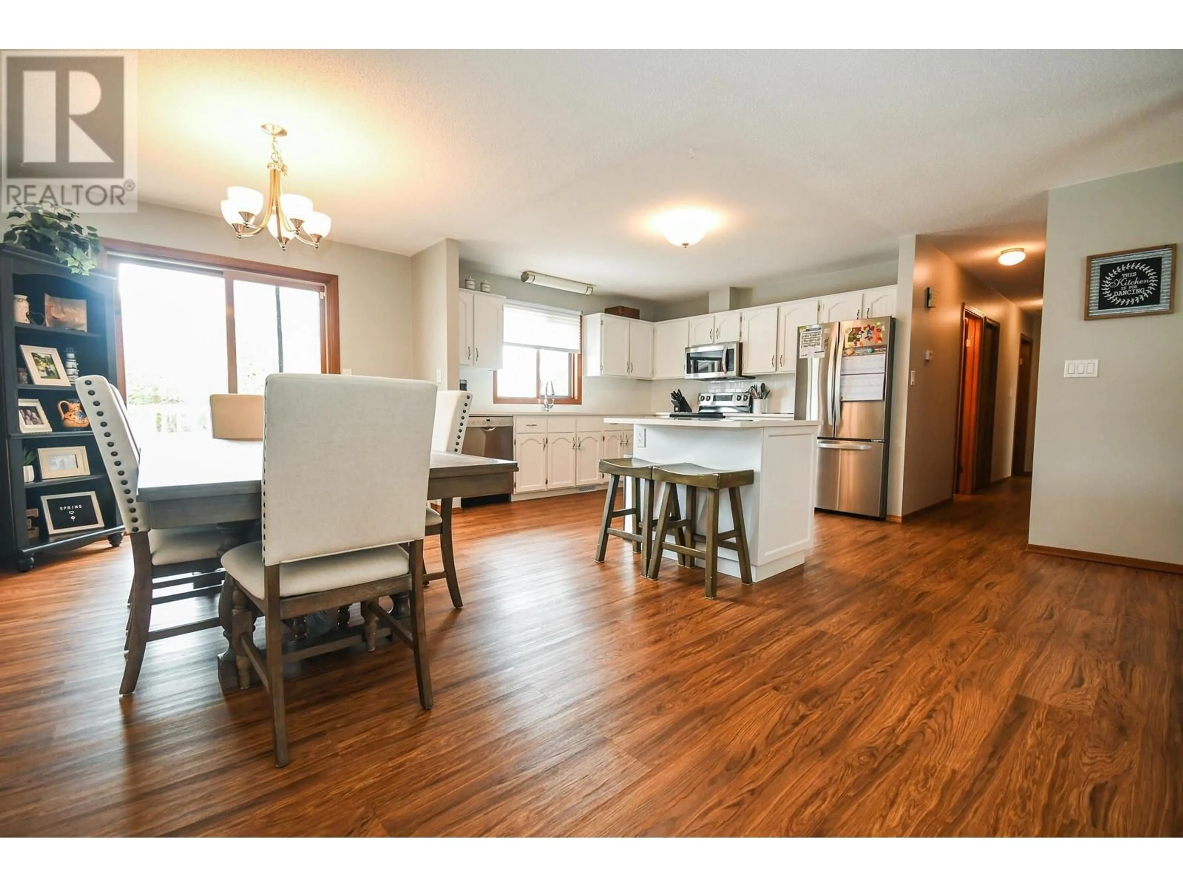 Open concept kitchen, wood/laminate floor for 2904 CHRISTOPHER CRESCENT, Prince George British Columbia V2N4S4