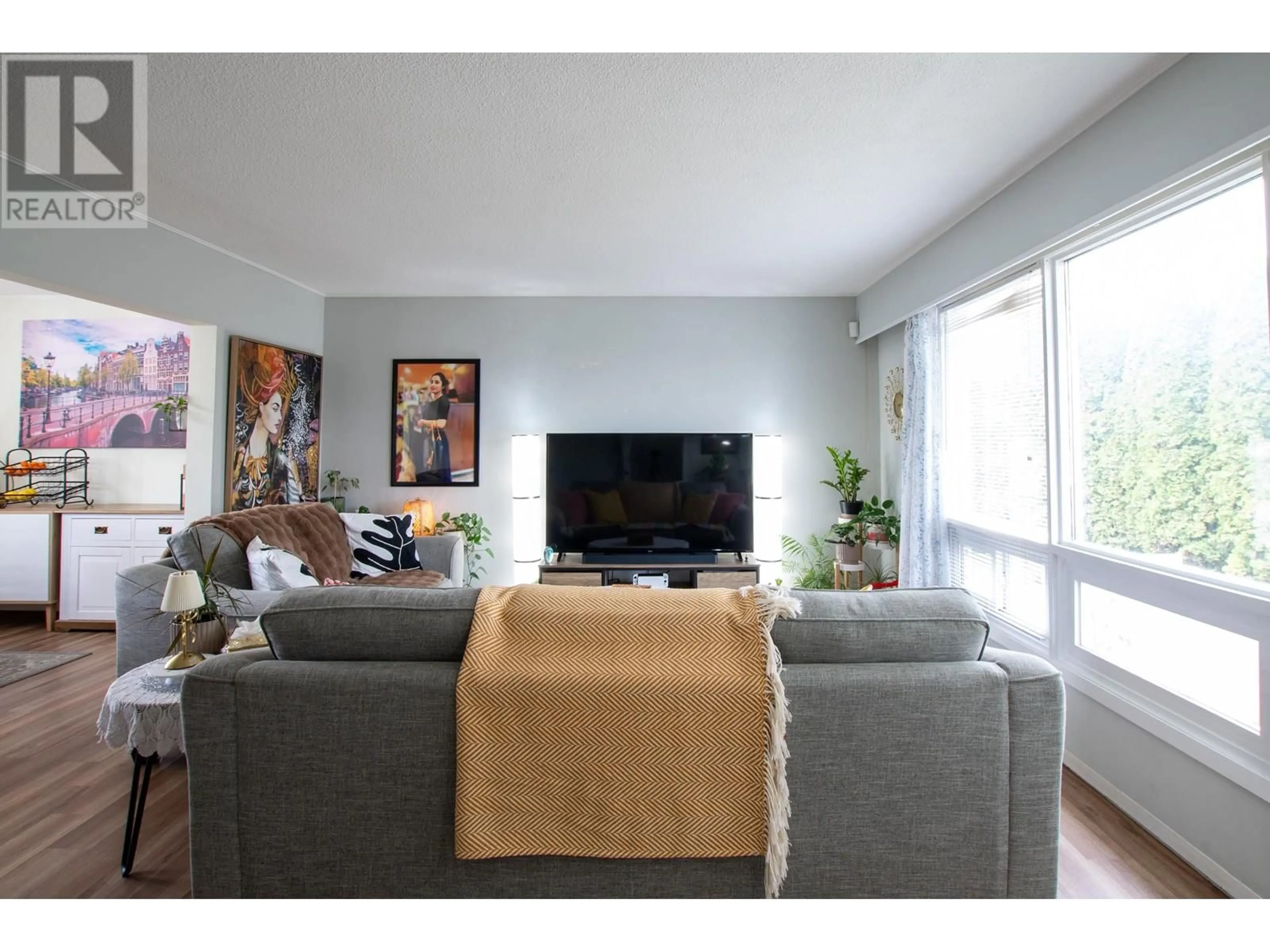 Living room with furniture, wood/laminate floor for 766 CARNEY STREET, Prince George British Columbia V2M2X6