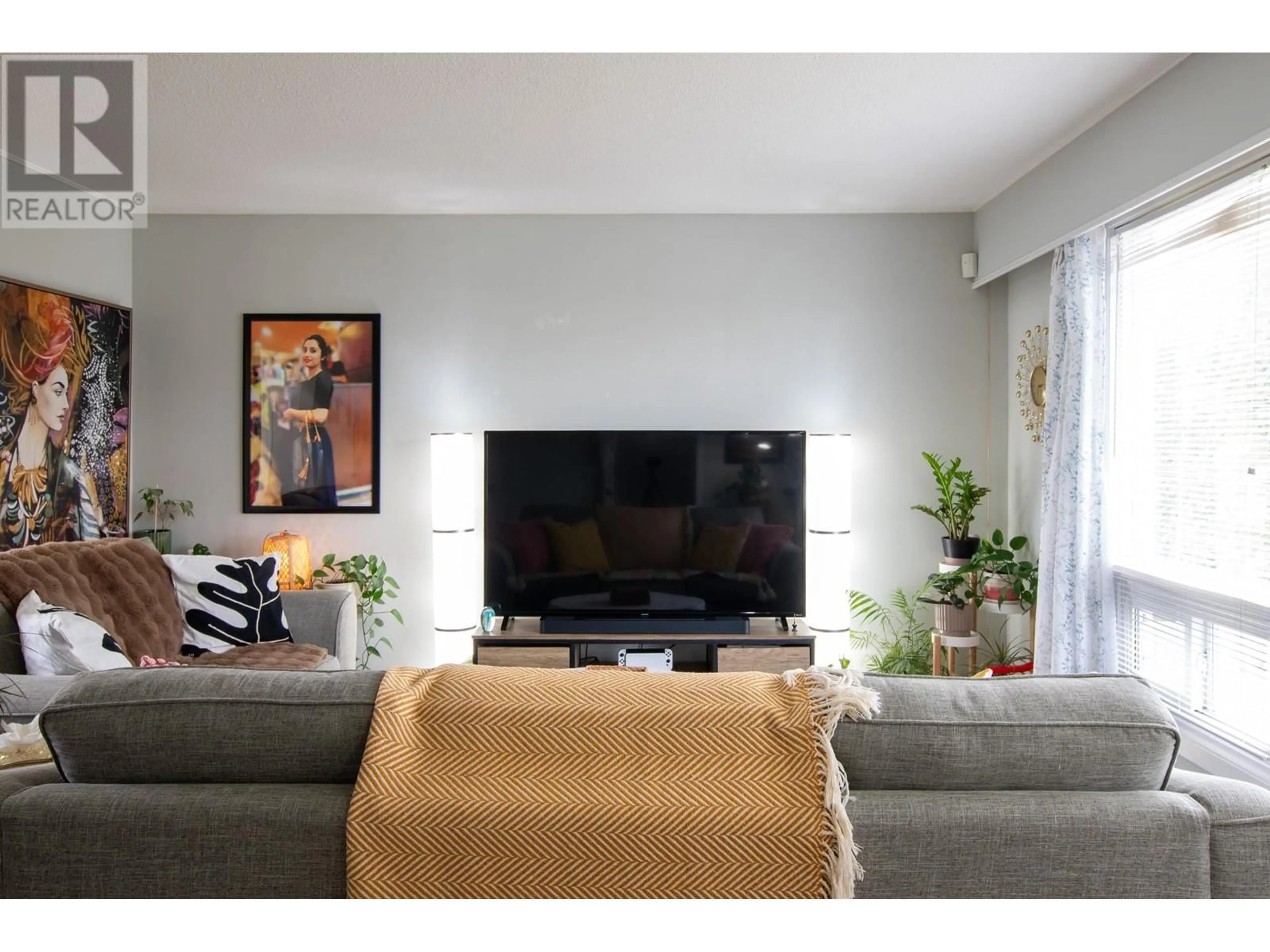 Living room with furniture, wood/laminate floor for 766 CARNEY STREET, Prince George British Columbia V2M2X6