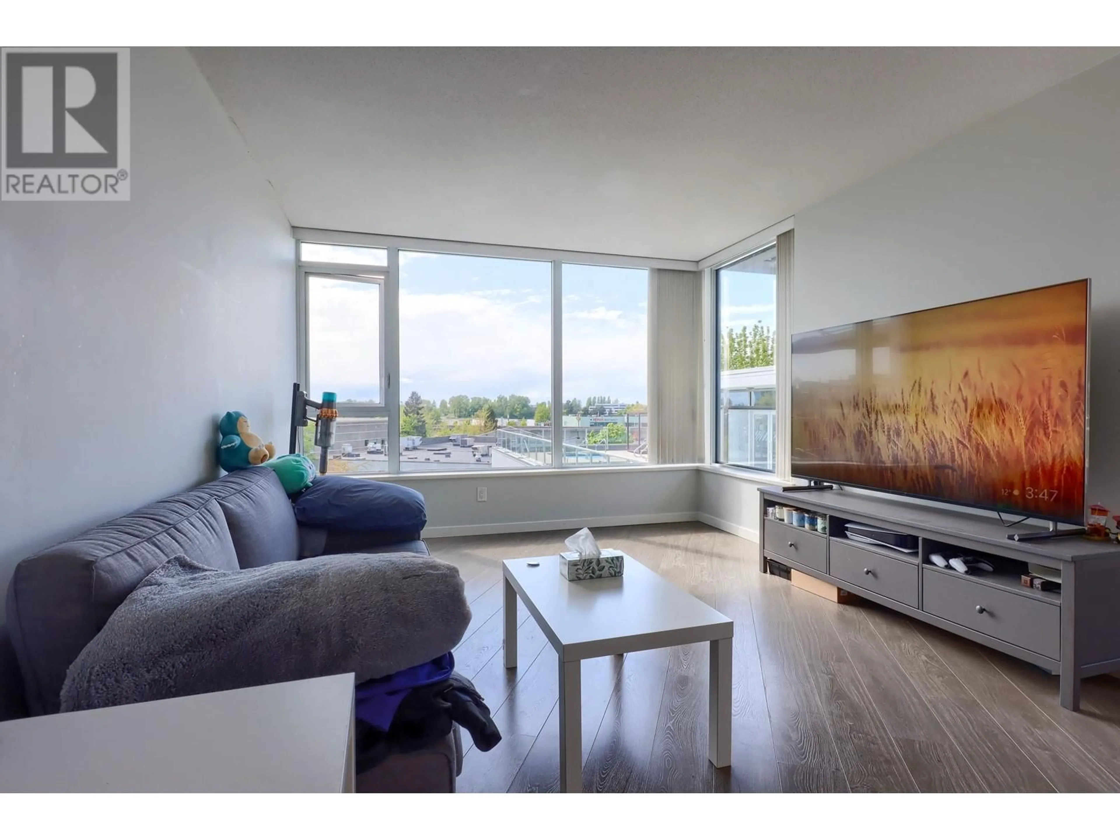 Living room with furniture, wood/laminate floor for 617 - 8333 SWEET AVENUE, Richmond British Columbia V6X0P4