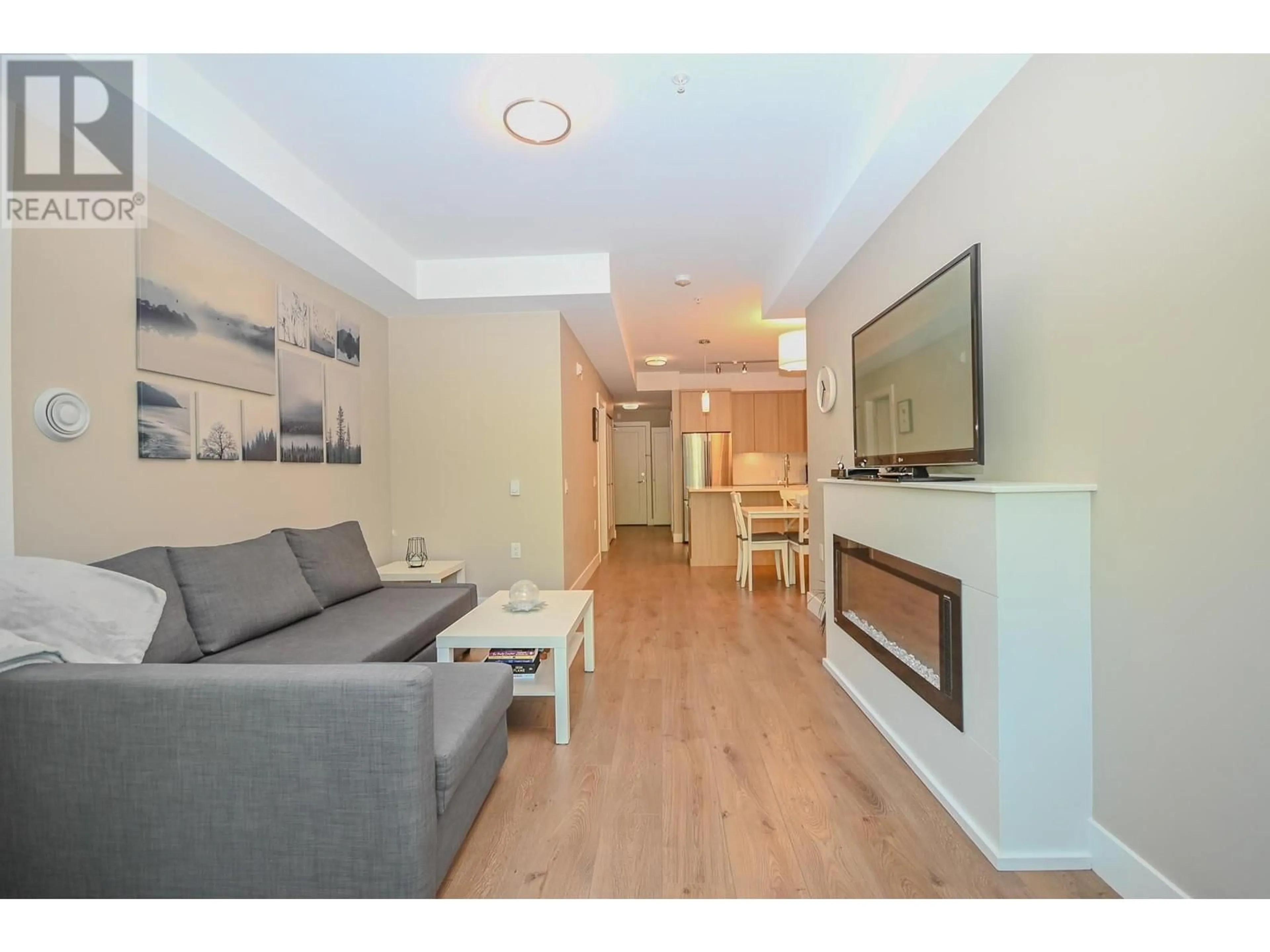 Living room with furniture, wood/laminate floor for 201 - 12460 191 STREET, Pitt Meadows British Columbia V3Y2J2