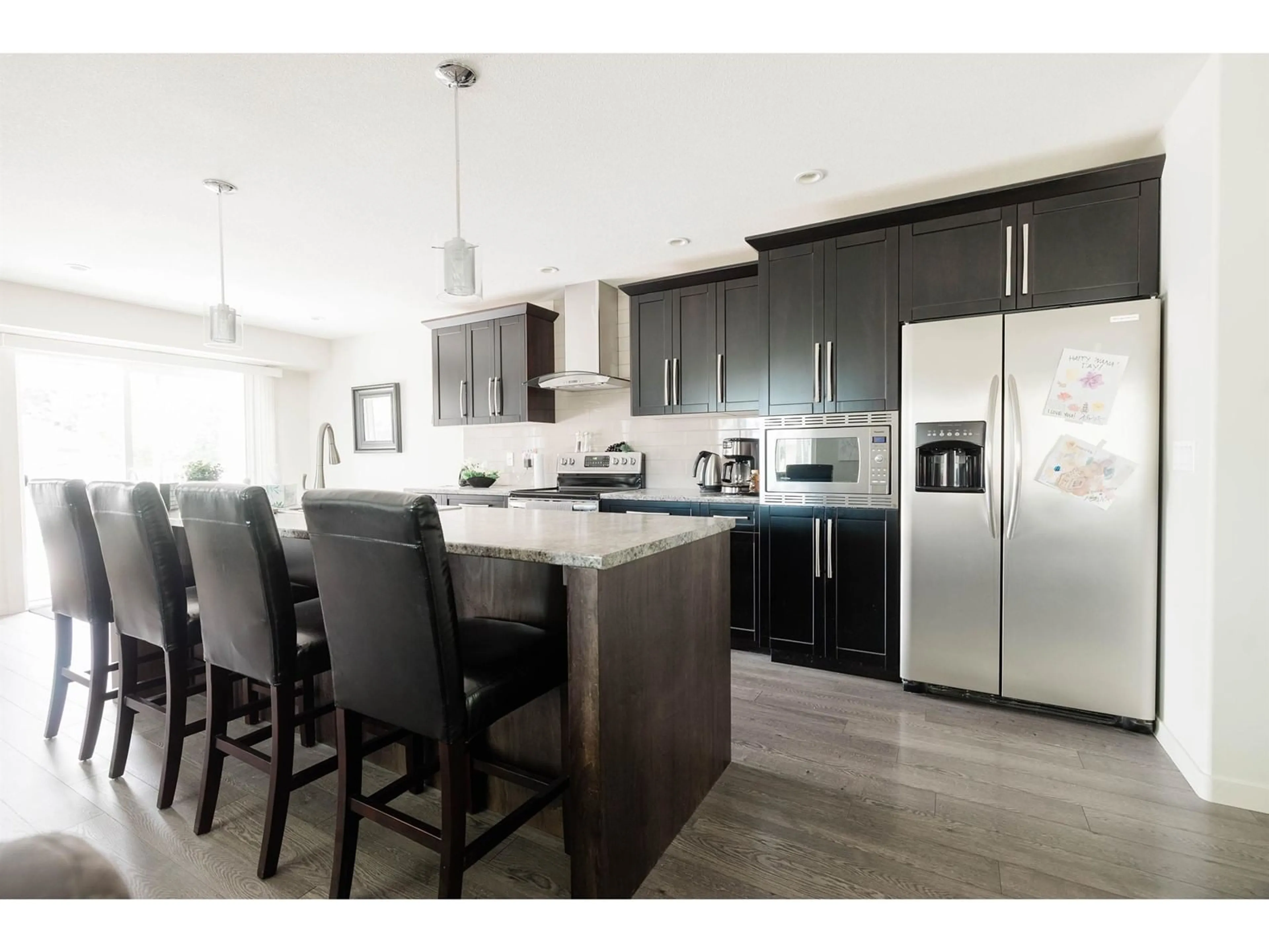 Open concept kitchen, wood/laminate floor for 22120 45, Langley British Columbia V2Z1B6