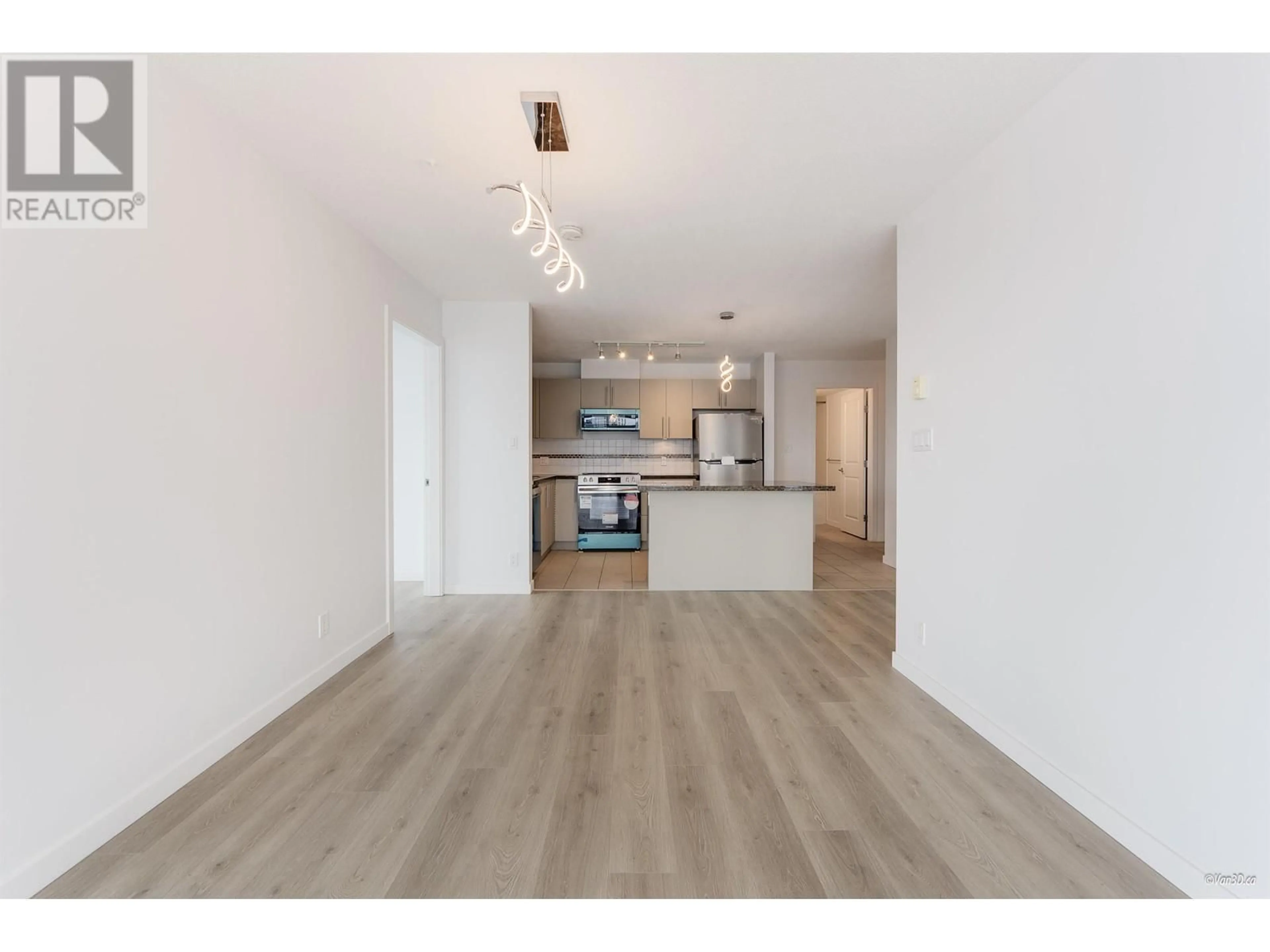 Open concept kitchen, wood/laminate floor for 2106 - 5611 GORING STREET, Burnaby British Columbia V5B0A3