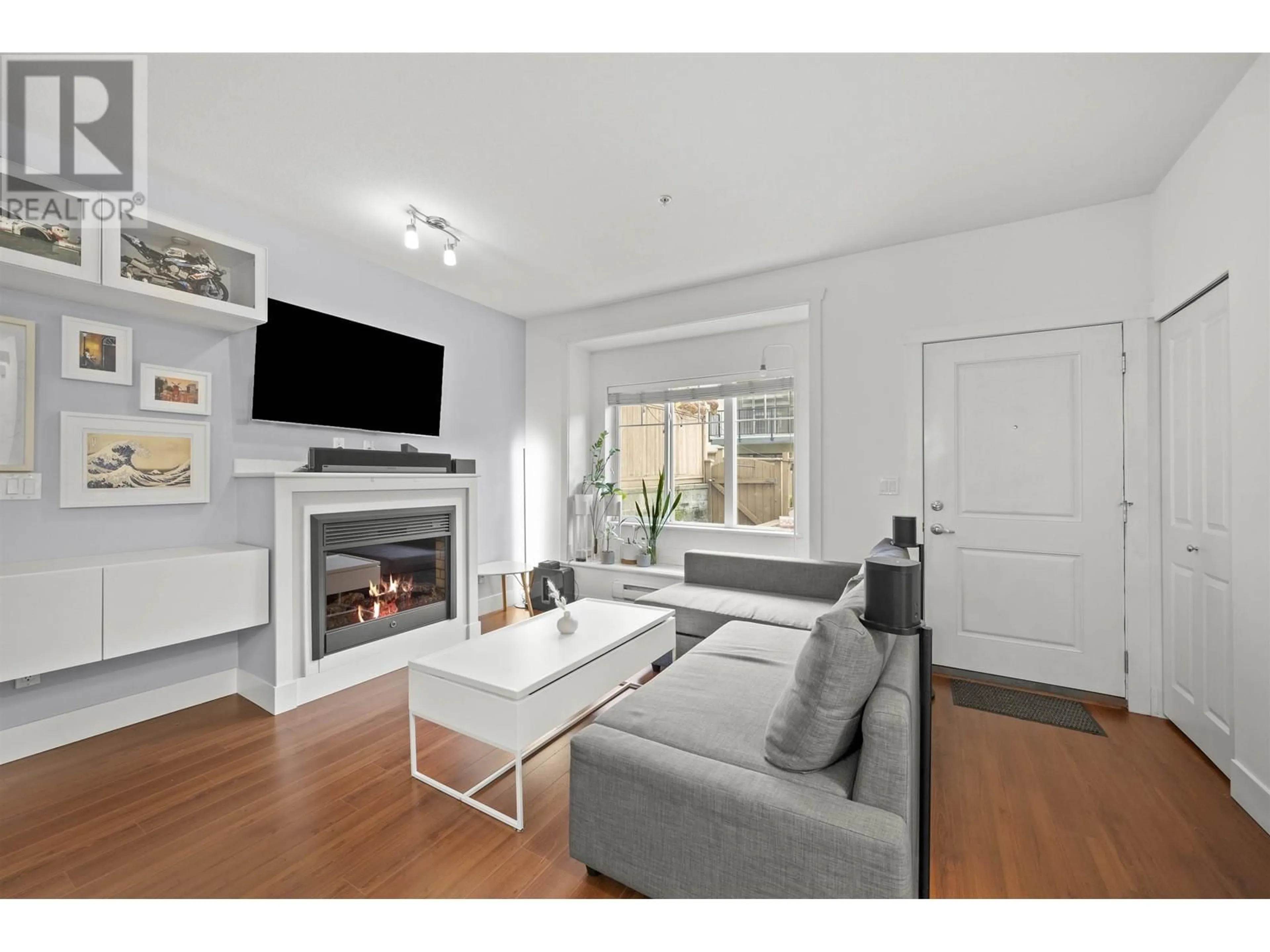 Living room with furniture, wood/laminate floor for 110 - 368 ELLESMERE AVENUE, Burnaby British Columbia V5B3S9
