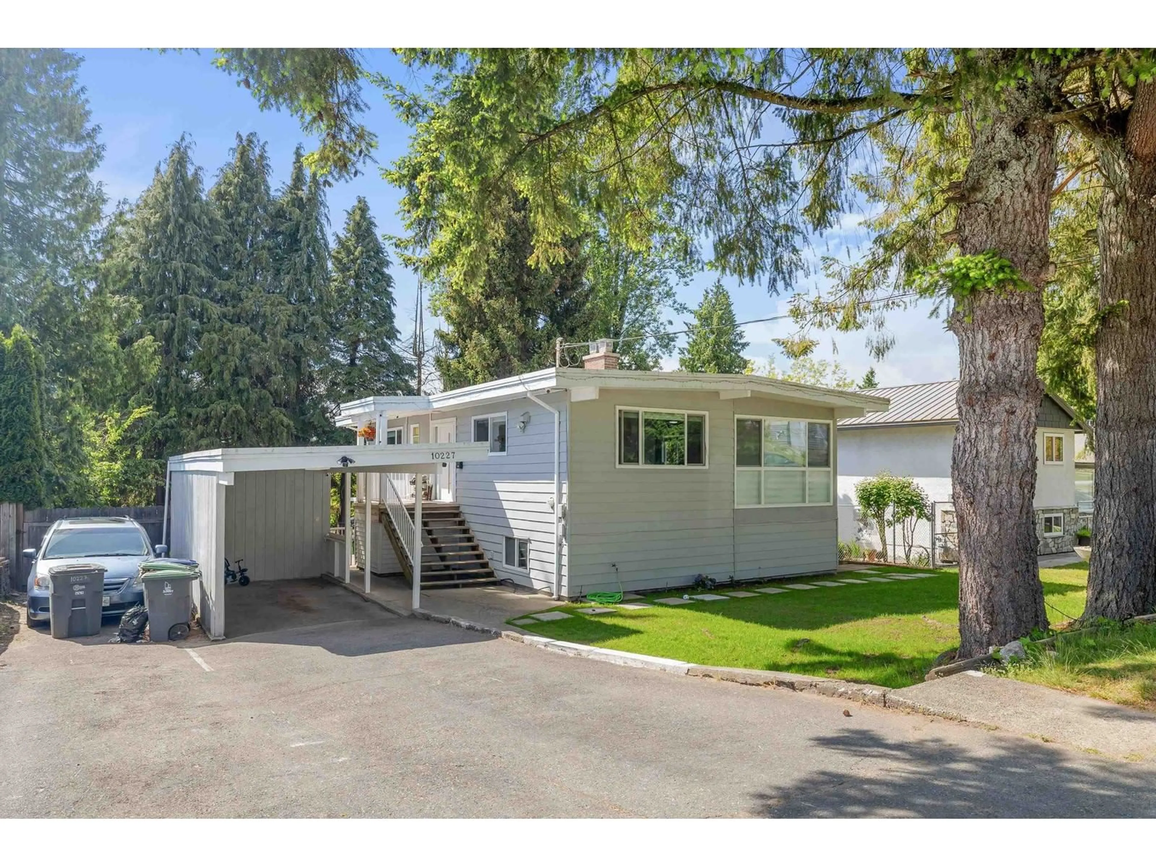 Home with vinyl exterior material, street for 10227 127, Surrey British Columbia V3V5J8