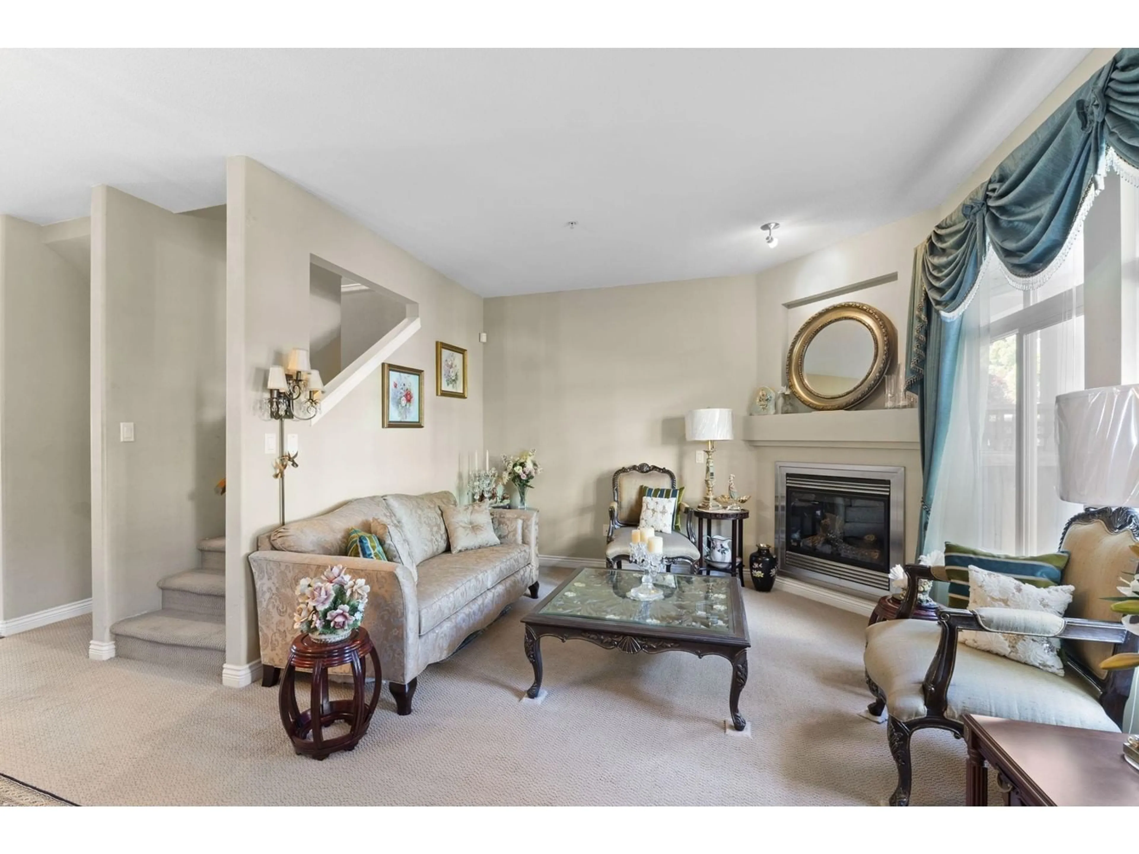 Living room with furniture, carpet floor for 104 - 20449 66, Langley British Columbia V2Y3C1
