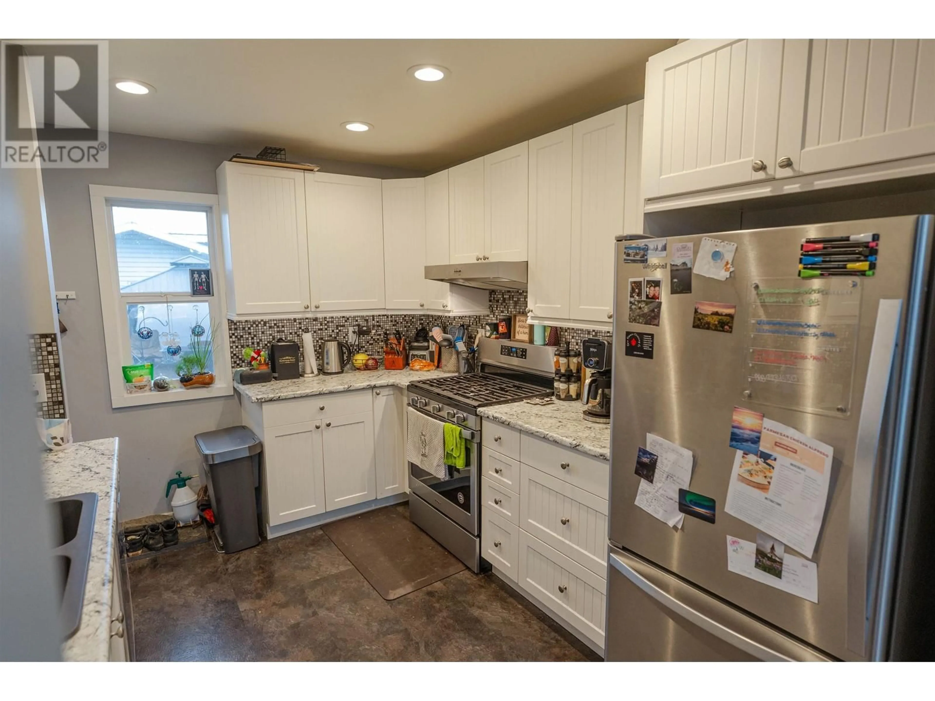 Open concept kitchen, ceramic/tile floor for 9812 102 AVENUE, Fort St. John British Columbia V1J2E1