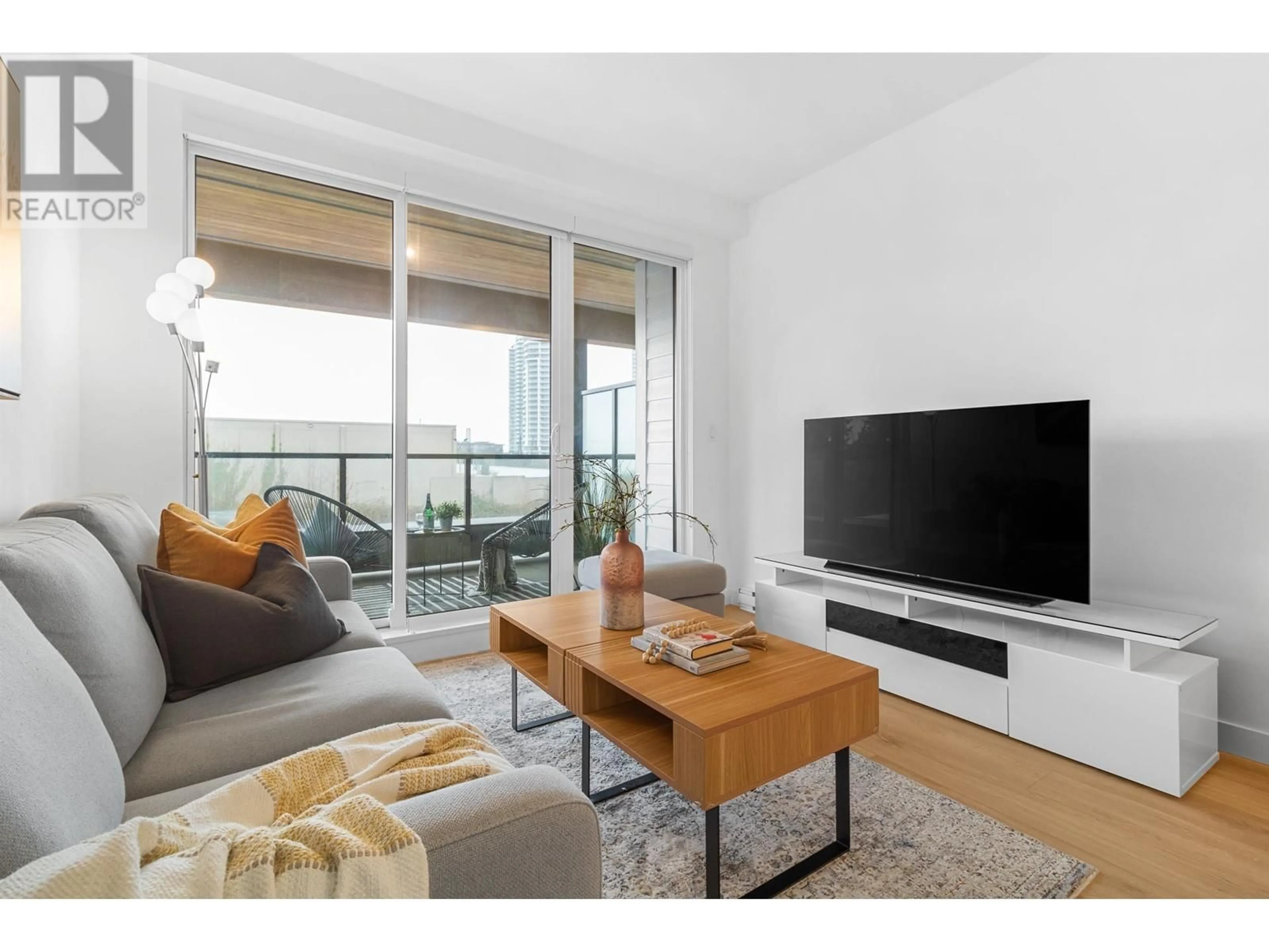 Living room with furniture, wood/laminate floor for 413 - 7579 16TH STREET, Burnaby British Columbia V3N0H7