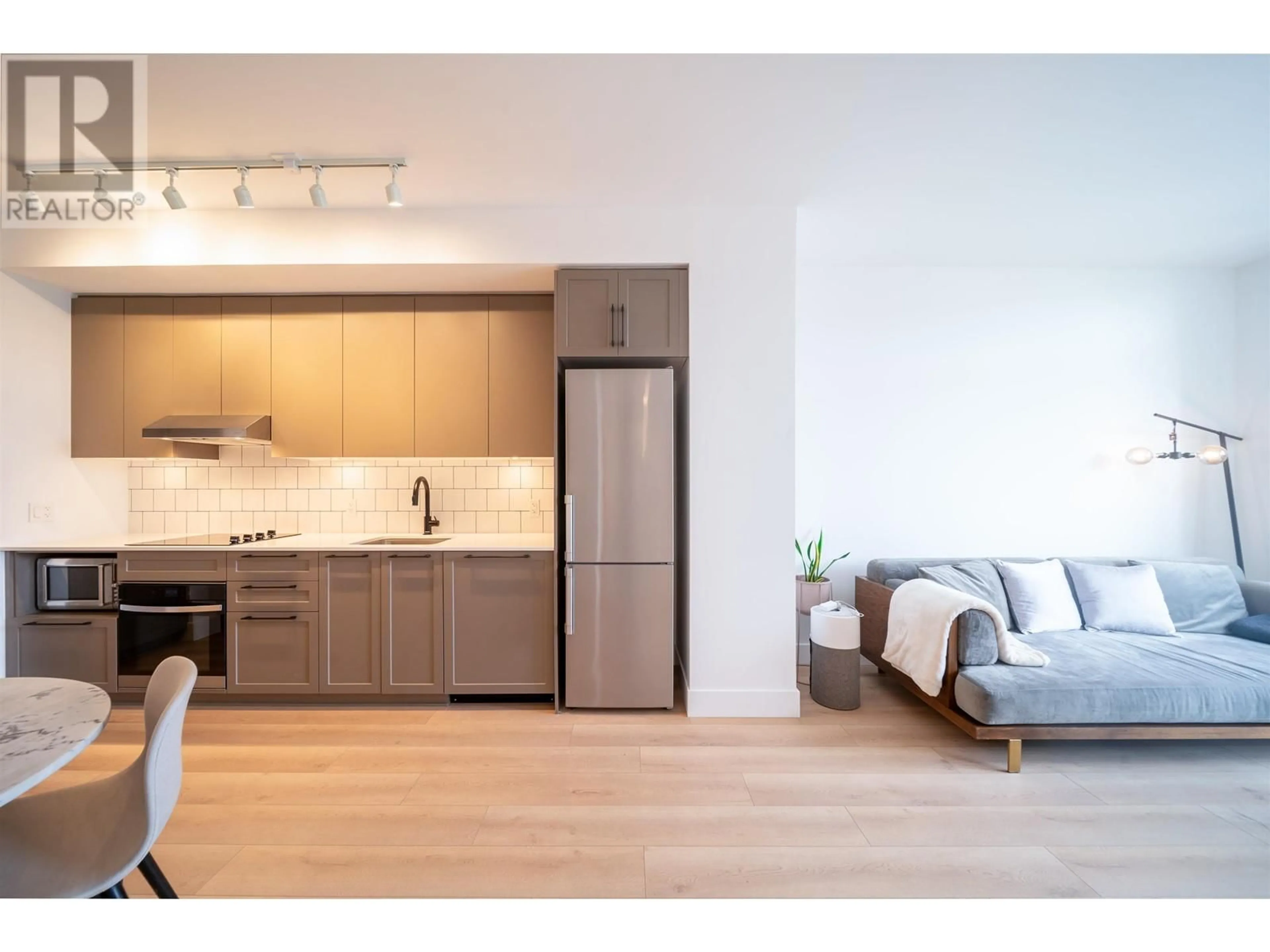 Open concept kitchen, wood/laminate floor for 509 - 8750 UNIVERSITY CRESCENT, Burnaby British Columbia V5A0G9