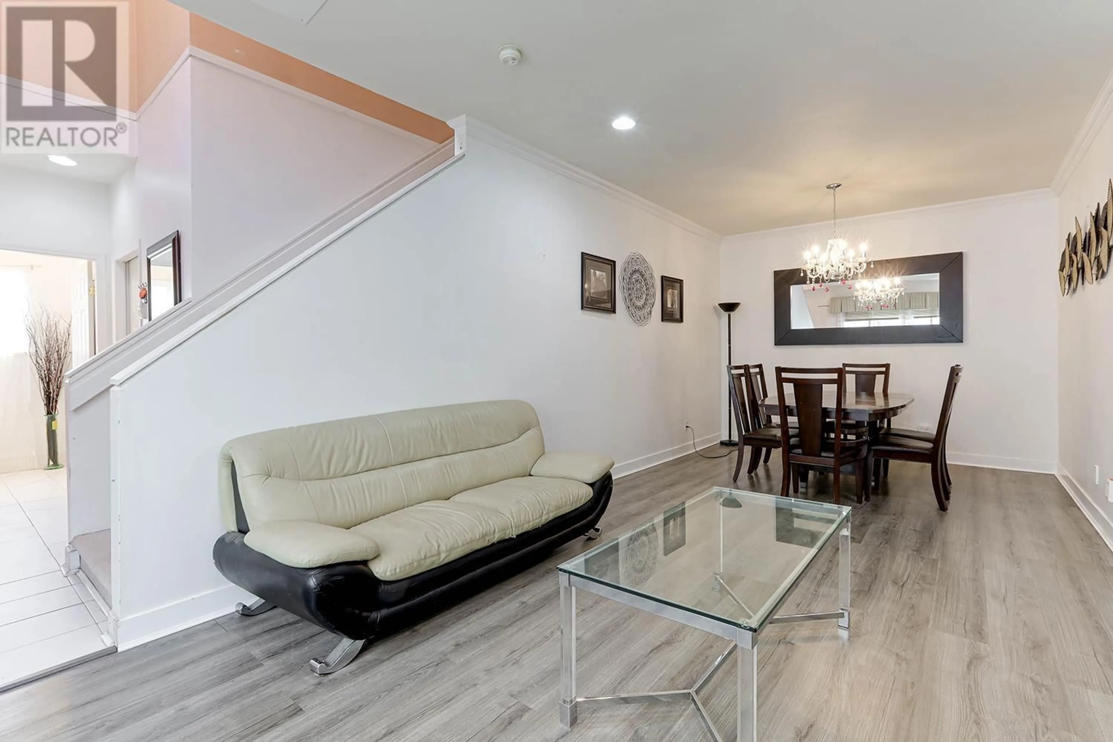 Living room with furniture, wood/laminate floor for 27 - 11888 MELLIS DRIVE, Richmond British Columbia V6X1M1