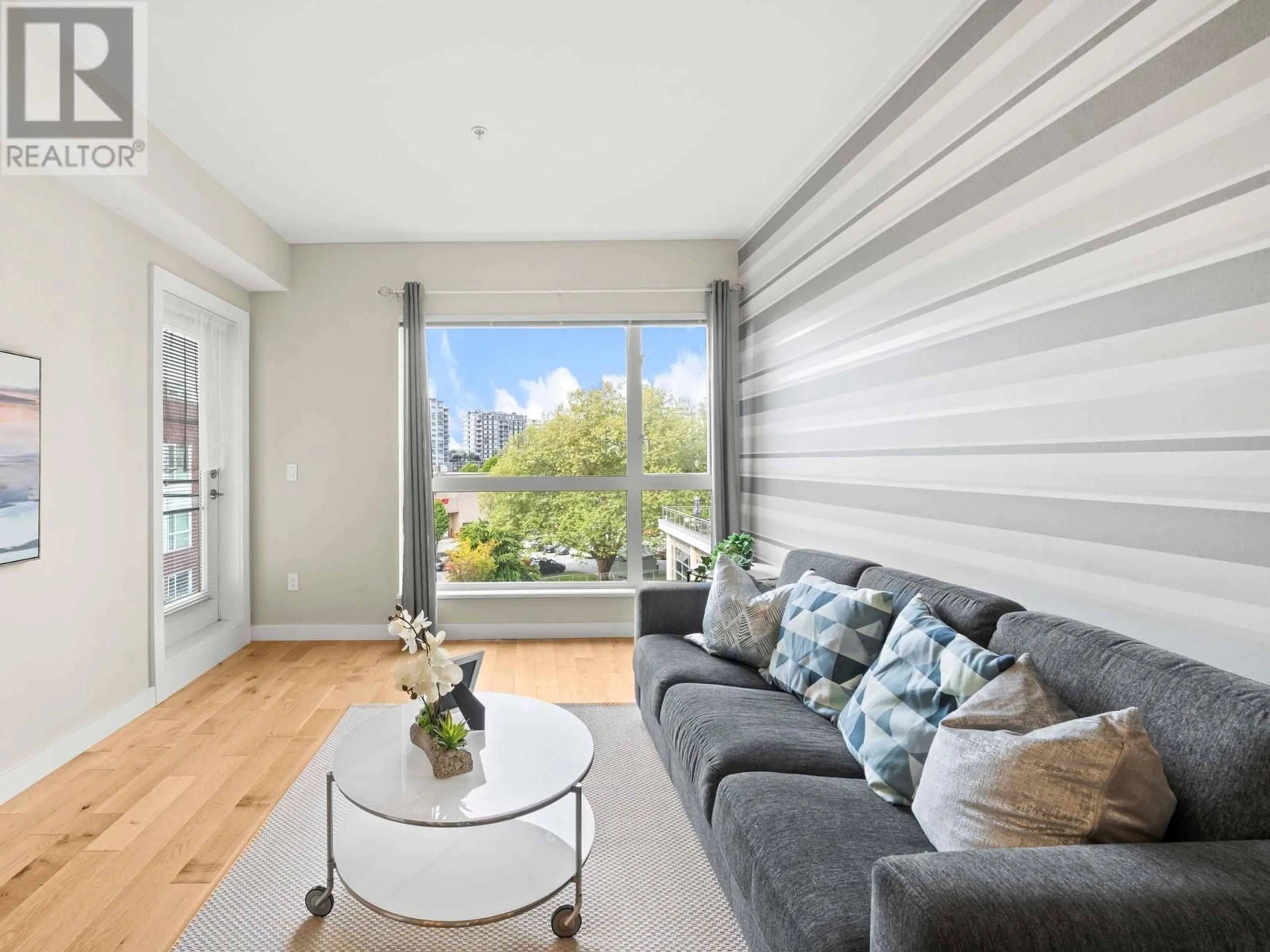 Living room with furniture, wood/laminate floor for 530 - 5399 CEDARBRIDGE WAY, Richmond British Columbia V6X0L6