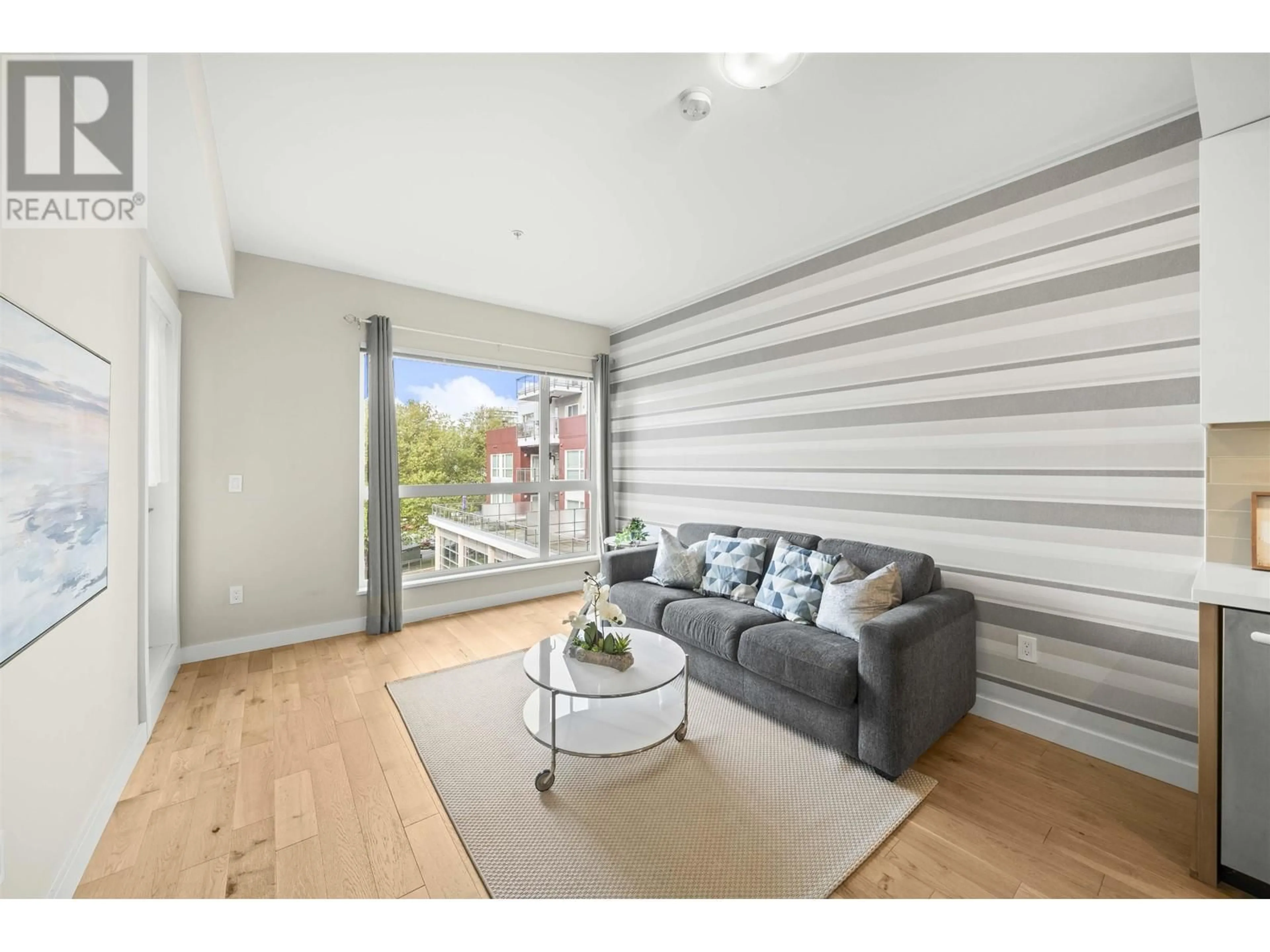 Living room with furniture, wood/laminate floor for 530 - 5399 CEDARBRIDGE WAY, Richmond British Columbia V6X0L6