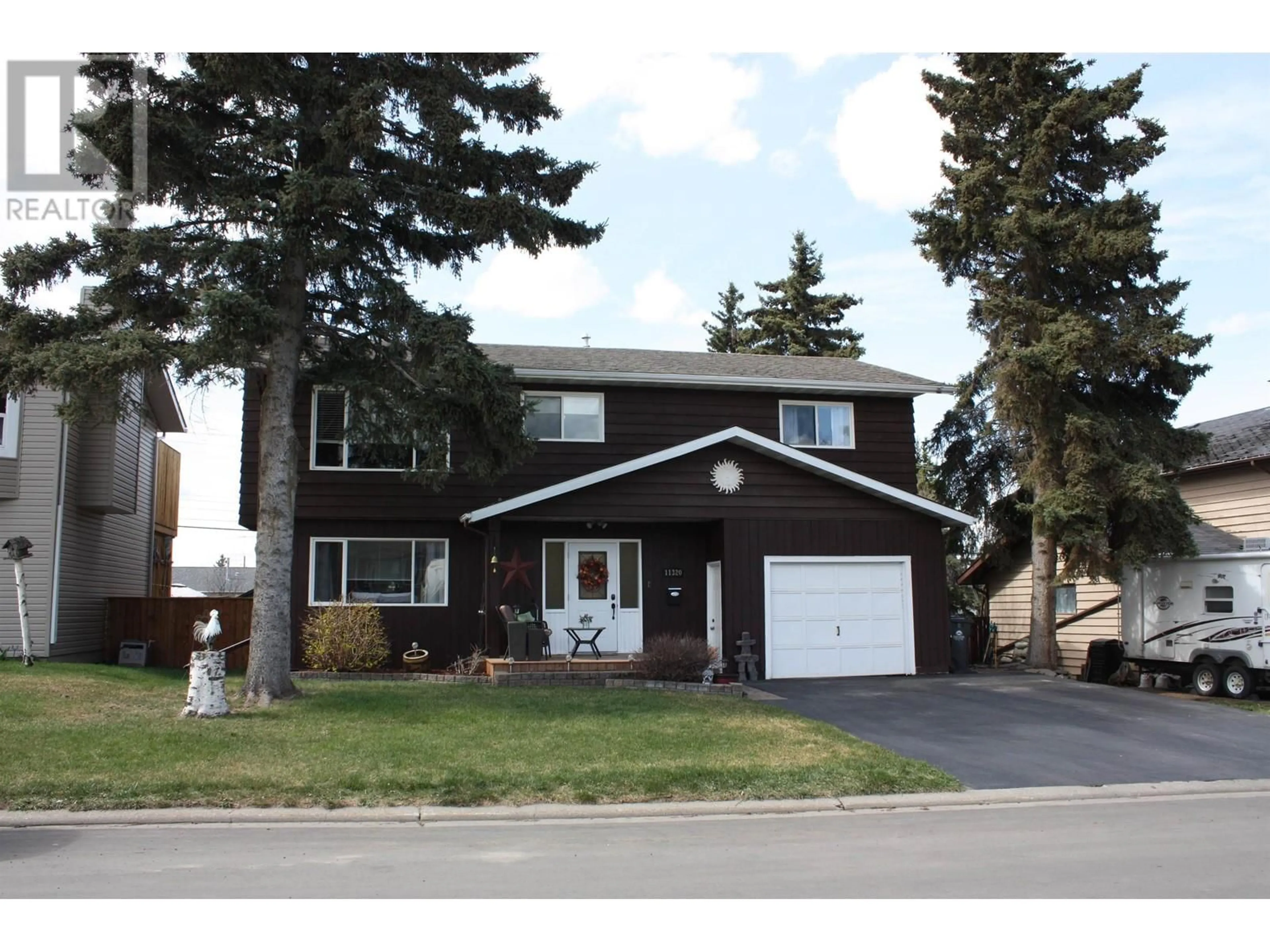 Home with vinyl exterior material, street for 11320 92 STREET, Fort St. John British Columbia V1J4Y3