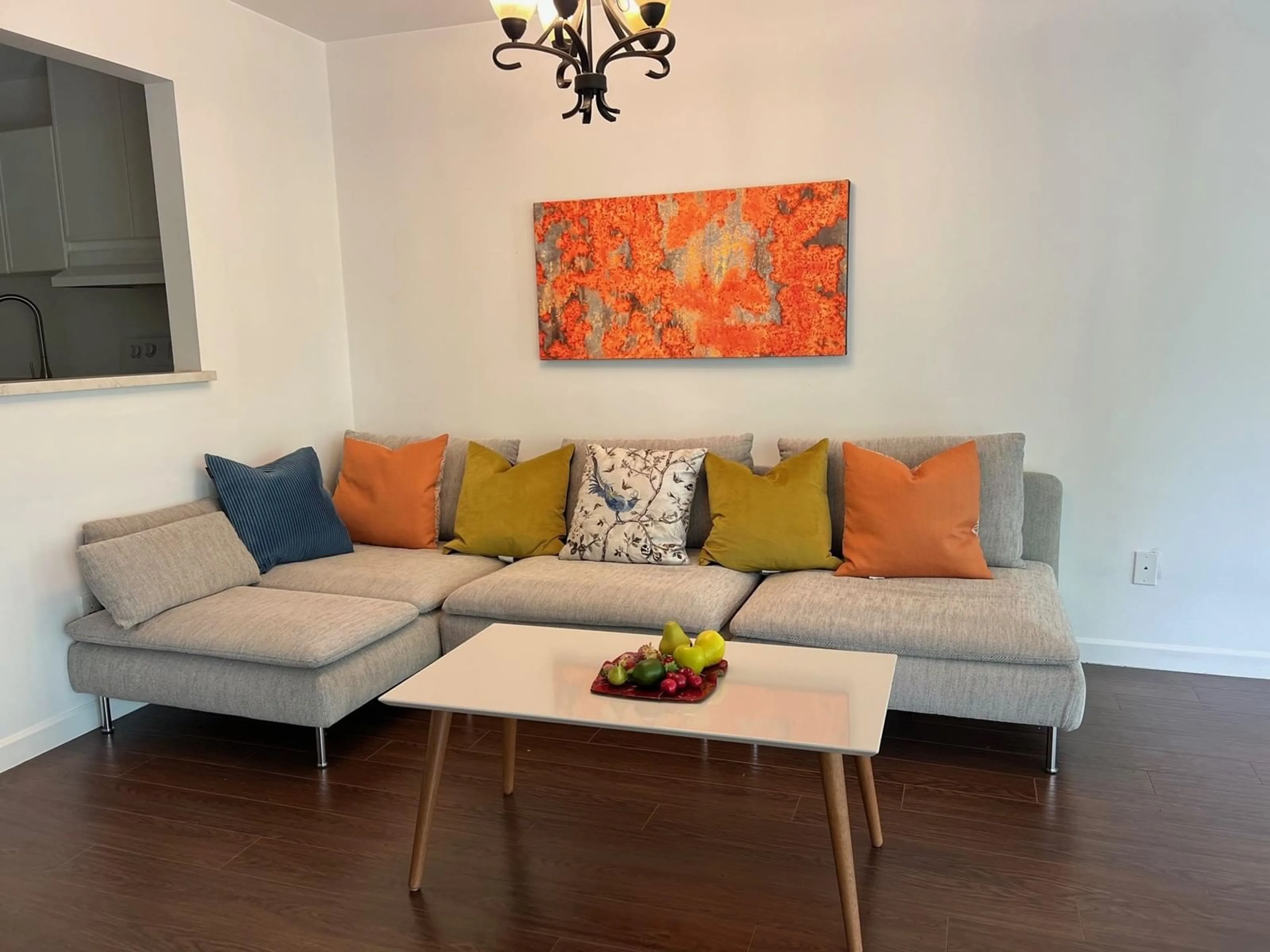 Living room with furniture, wood/laminate floor for 206 - 14980 101A, Surrey British Columbia V3R0T1