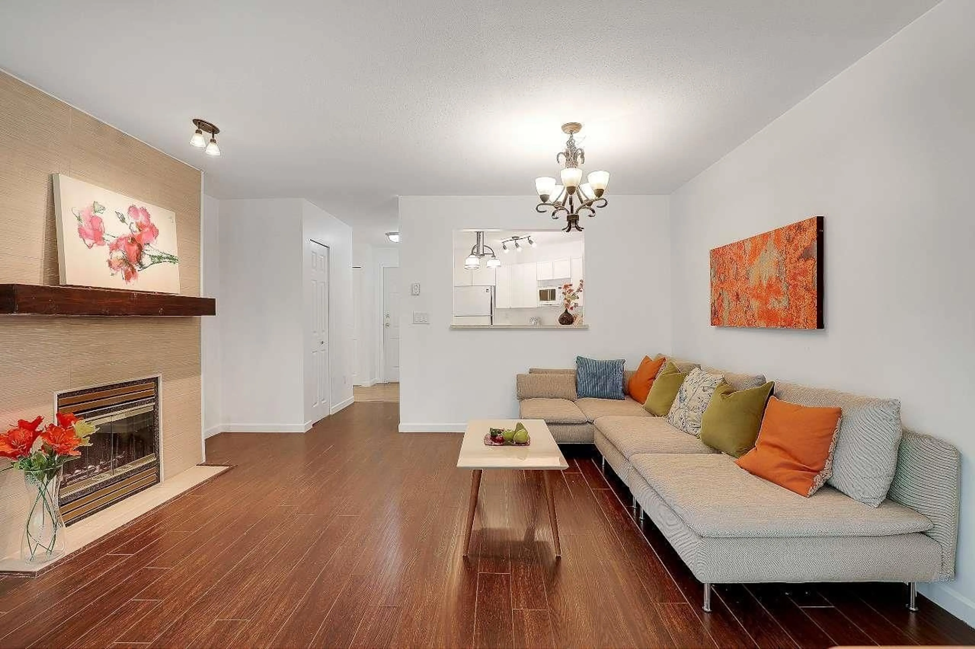 Living room with furniture, wood/laminate floor for 206 - 14980 101A, Surrey British Columbia V3R0T1