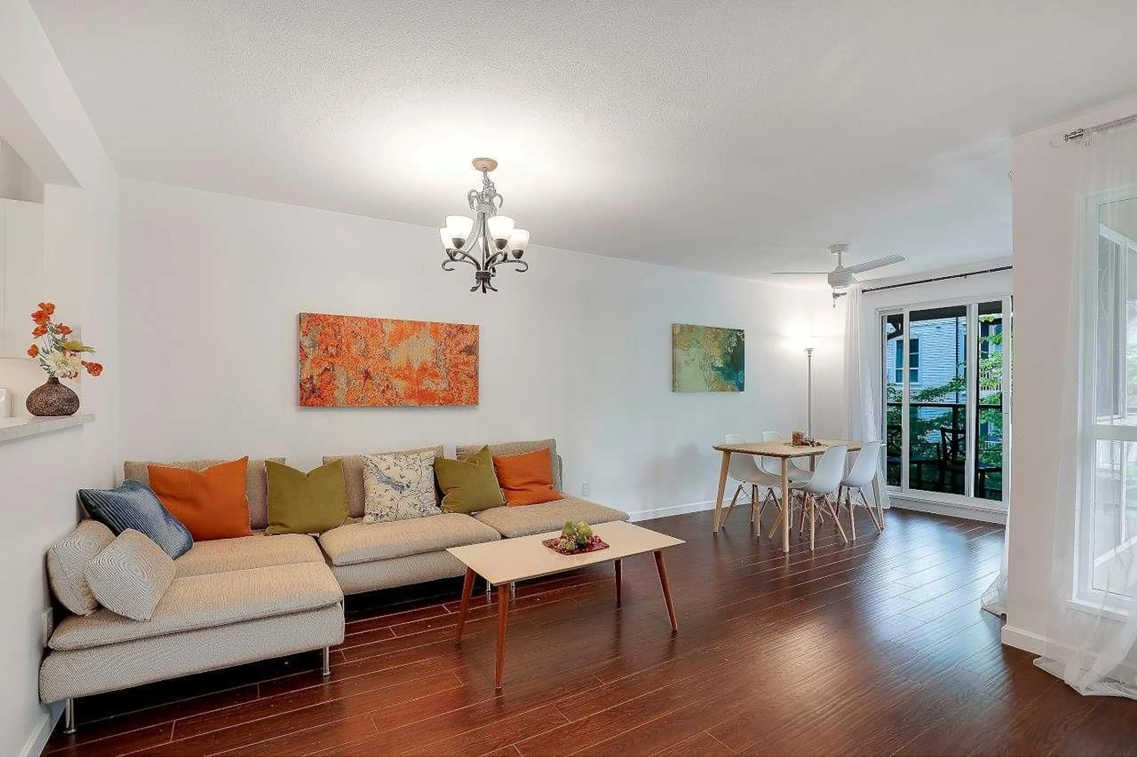 Living room with furniture, wood/laminate floor for 206 - 14980 101A, Surrey British Columbia V3R0T1