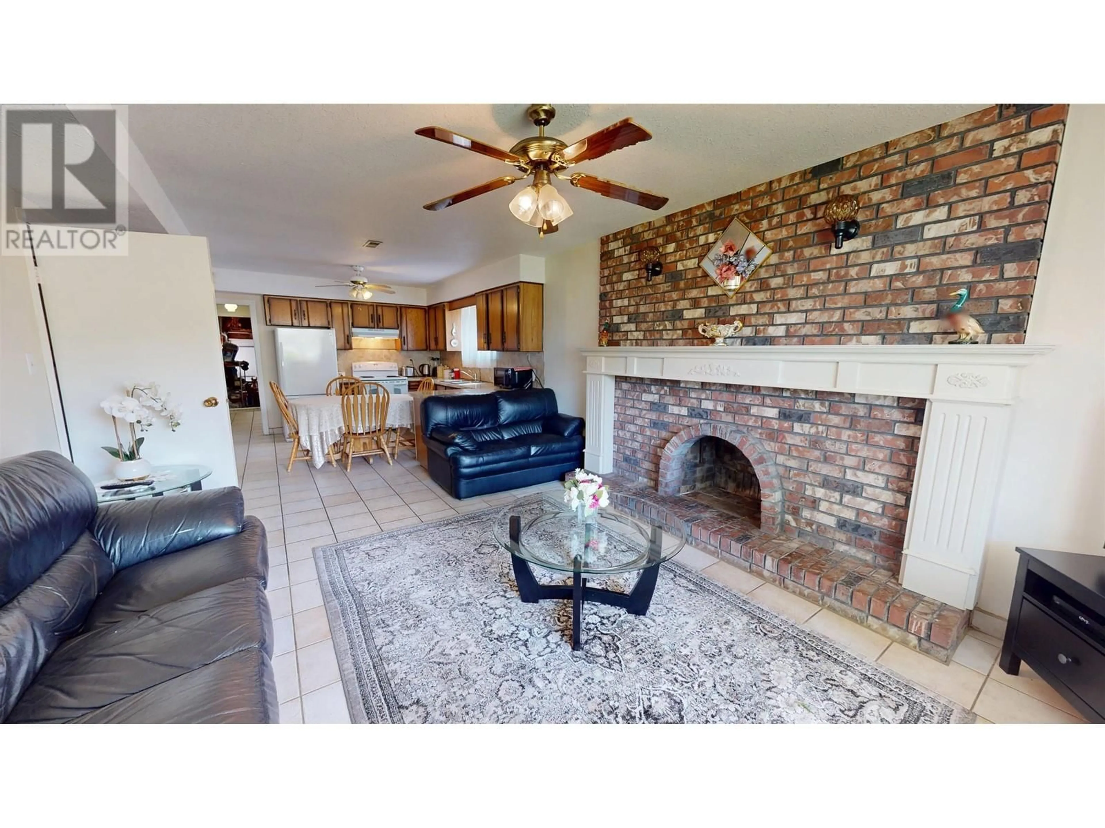 Living room with furniture, ceramic/tile floor for 4205 BEATRICE STREET, Vancouver British Columbia V5N4H9