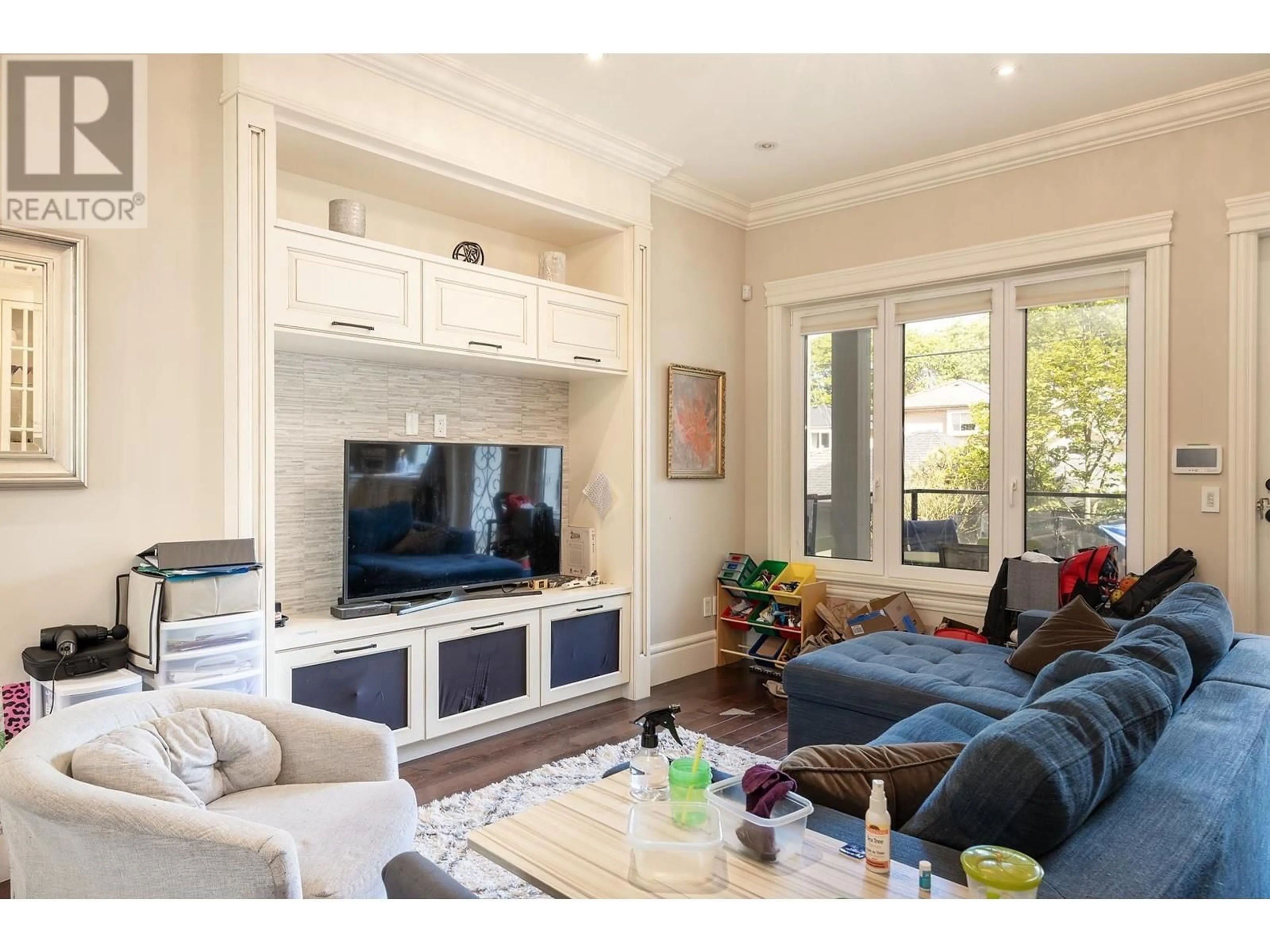 Living room with furniture, wood/laminate floor for 3149 28TH AVENUE, Vancouver British Columbia V6L1X4