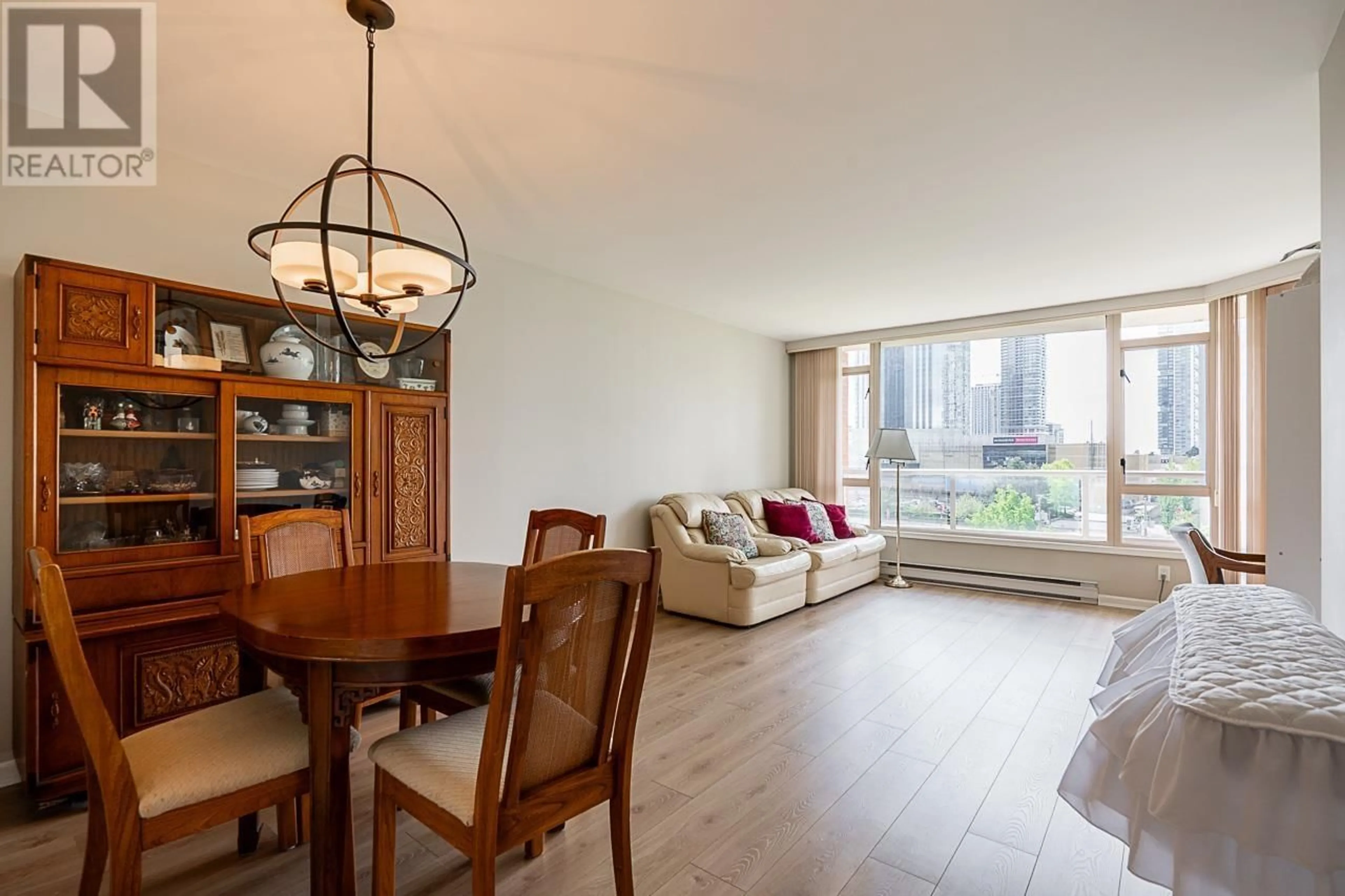 Living room with furniture, wood/laminate floor for 704 - 4657 HAZEL STREET, Burnaby British Columbia V5H4R2