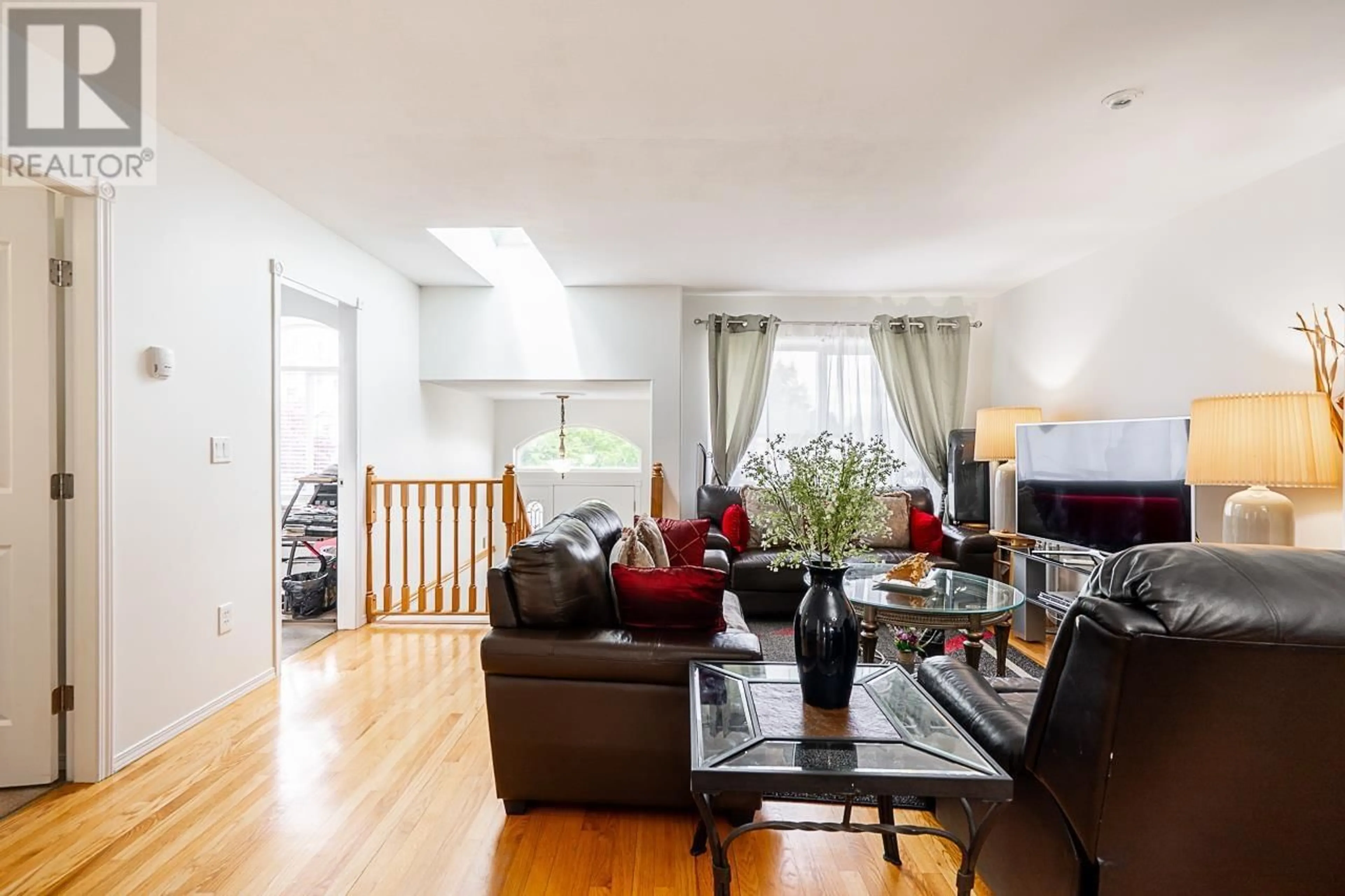 Living room with furniture, wood/laminate floor for 7936 EDMONDS STREET, Burnaby British Columbia V3N1C2