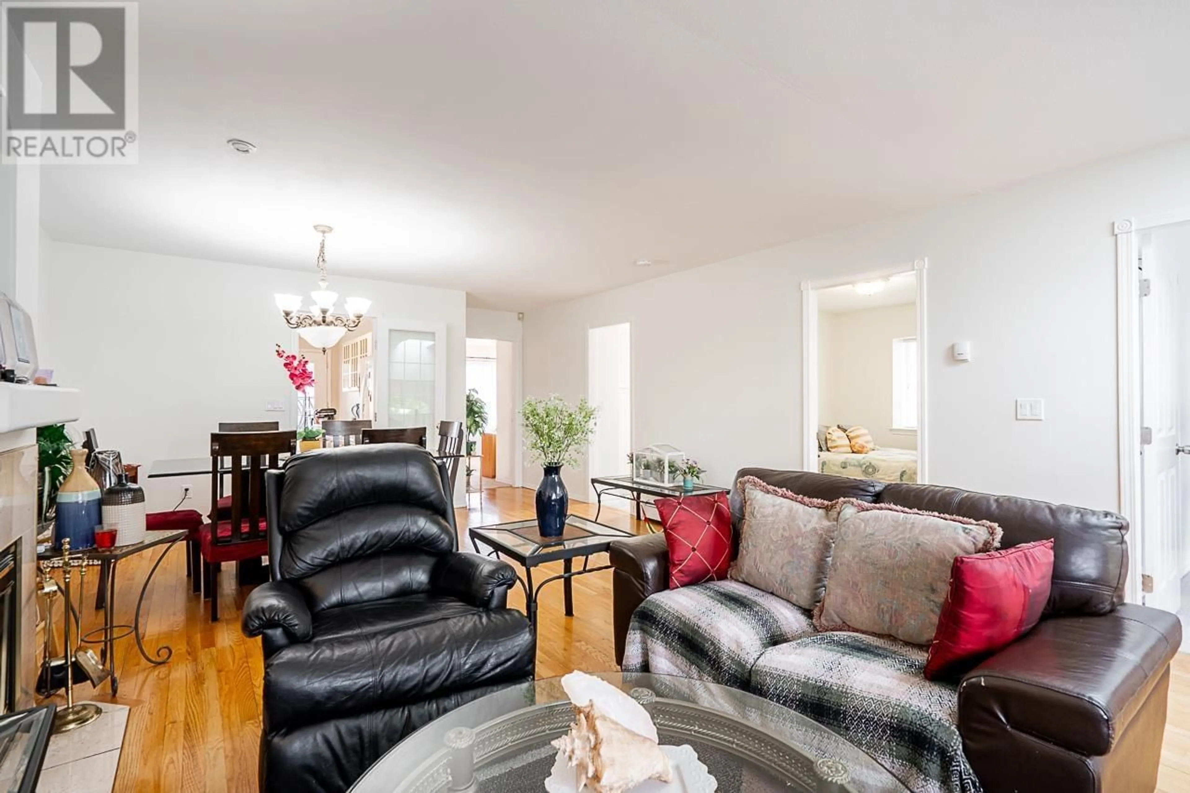 Living room with furniture, wood/laminate floor for 7936 EDMONDS STREET, Burnaby British Columbia V3N1C2