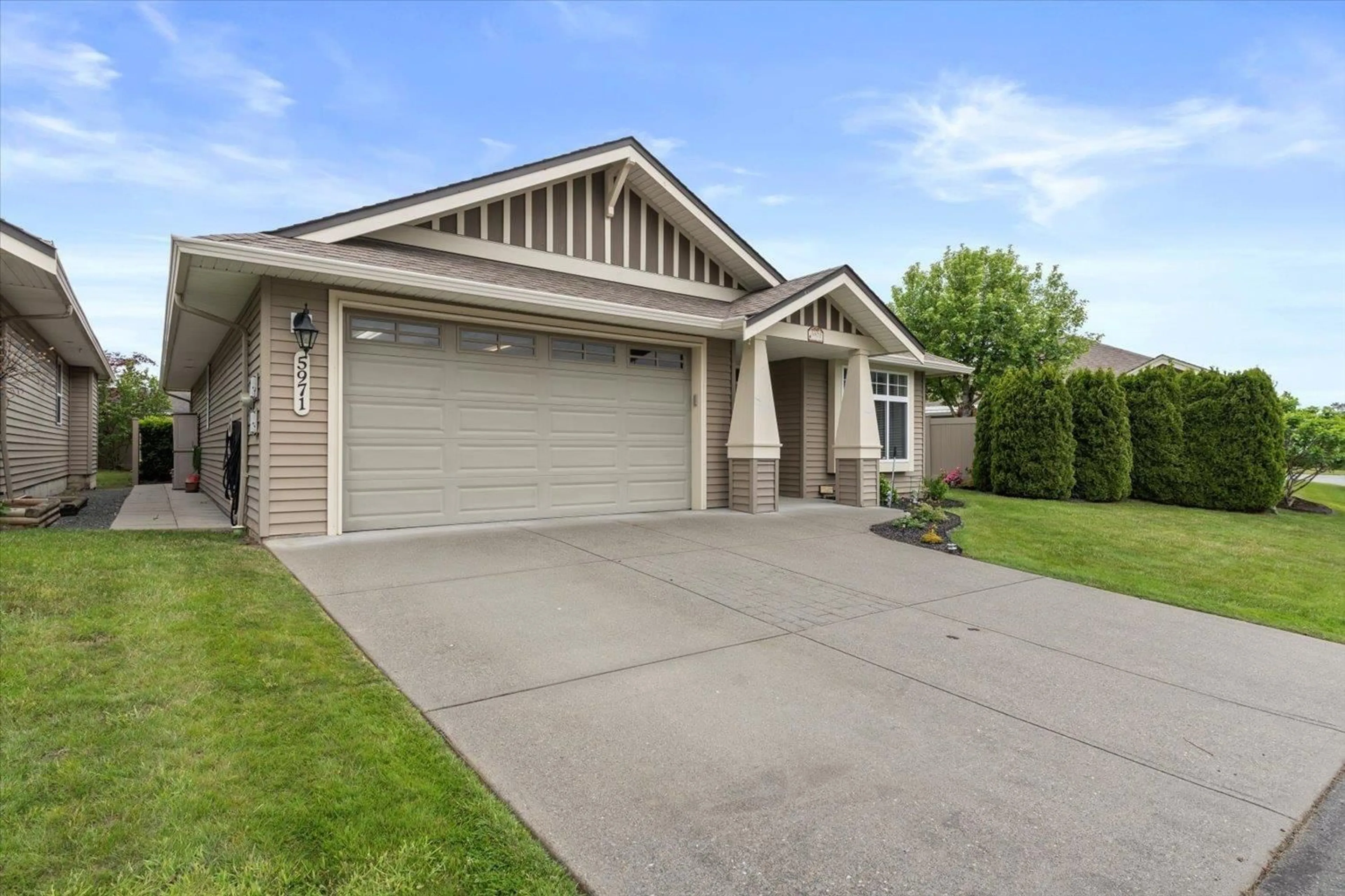 Home with vinyl exterior material, street for 5971 RIVERSTONE STREET, Chilliwack British Columbia V2R0E2