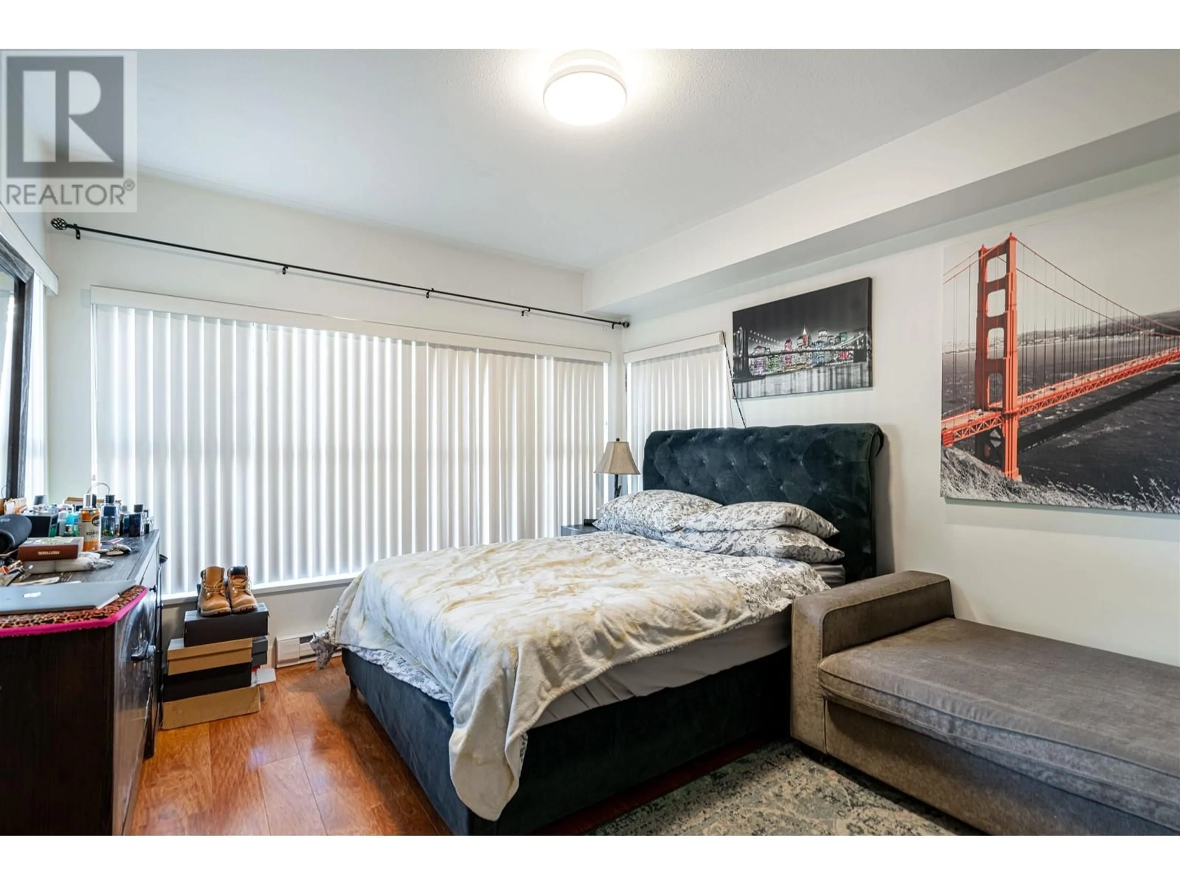 Bedroom with bed, wood/laminate floor for 203 - 1988 SUFFOLK AVENUE, Port Coquitlam British Columbia V3B1H2