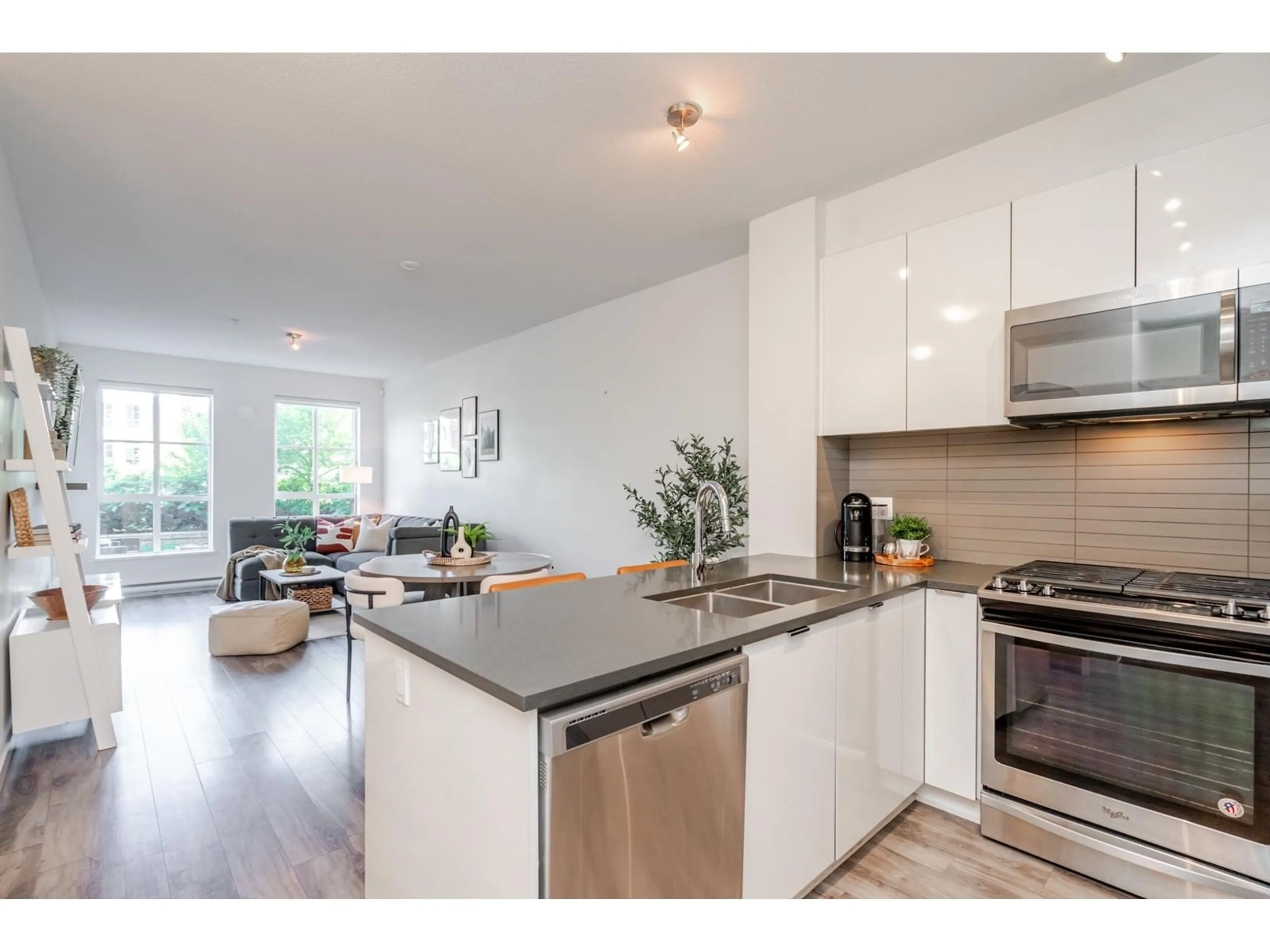 Open concept kitchen, wood/laminate floor for 101 - 15137 33, Surrey British Columbia V3Z0Y1