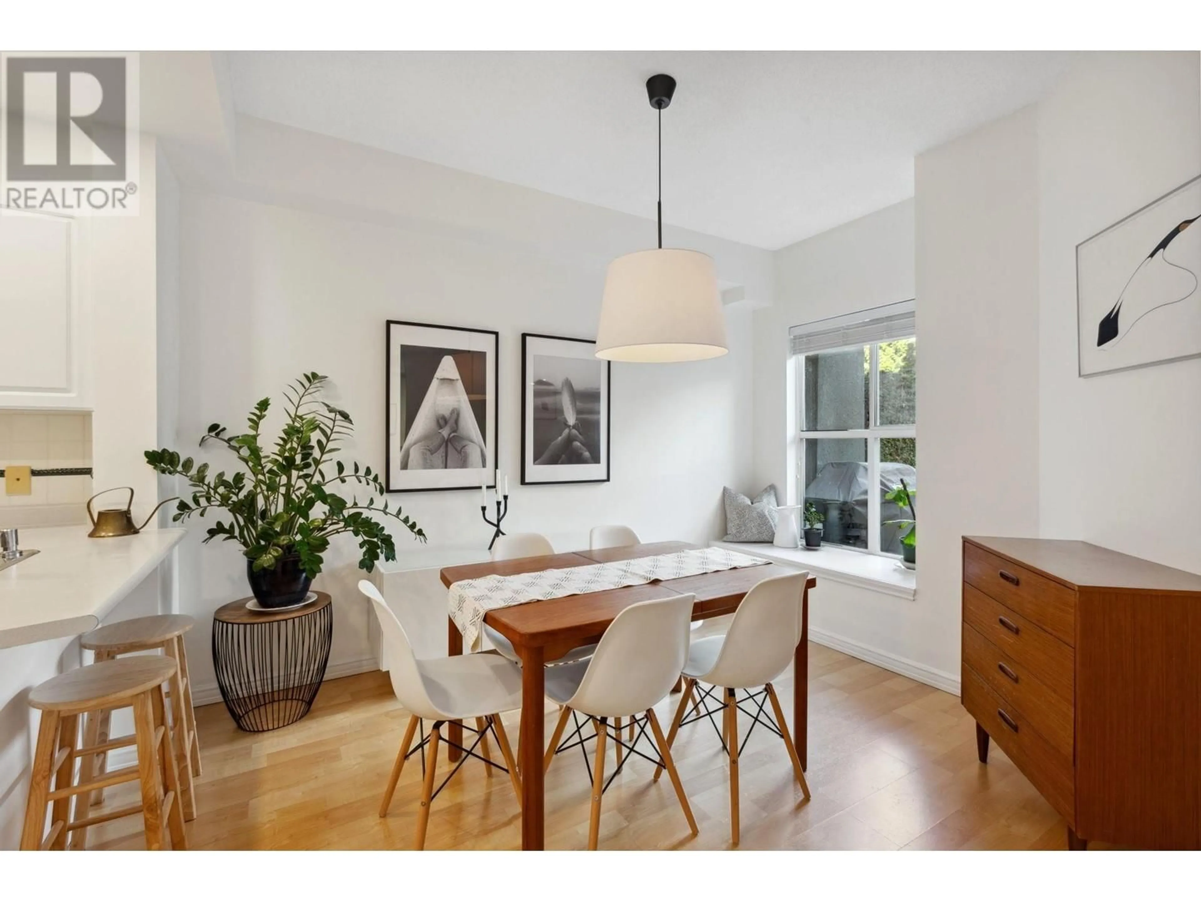Dining room, wood/laminate floor for 203 - 3600 WINDCREST DRIVE, North Vancouver British Columbia V7G2S5