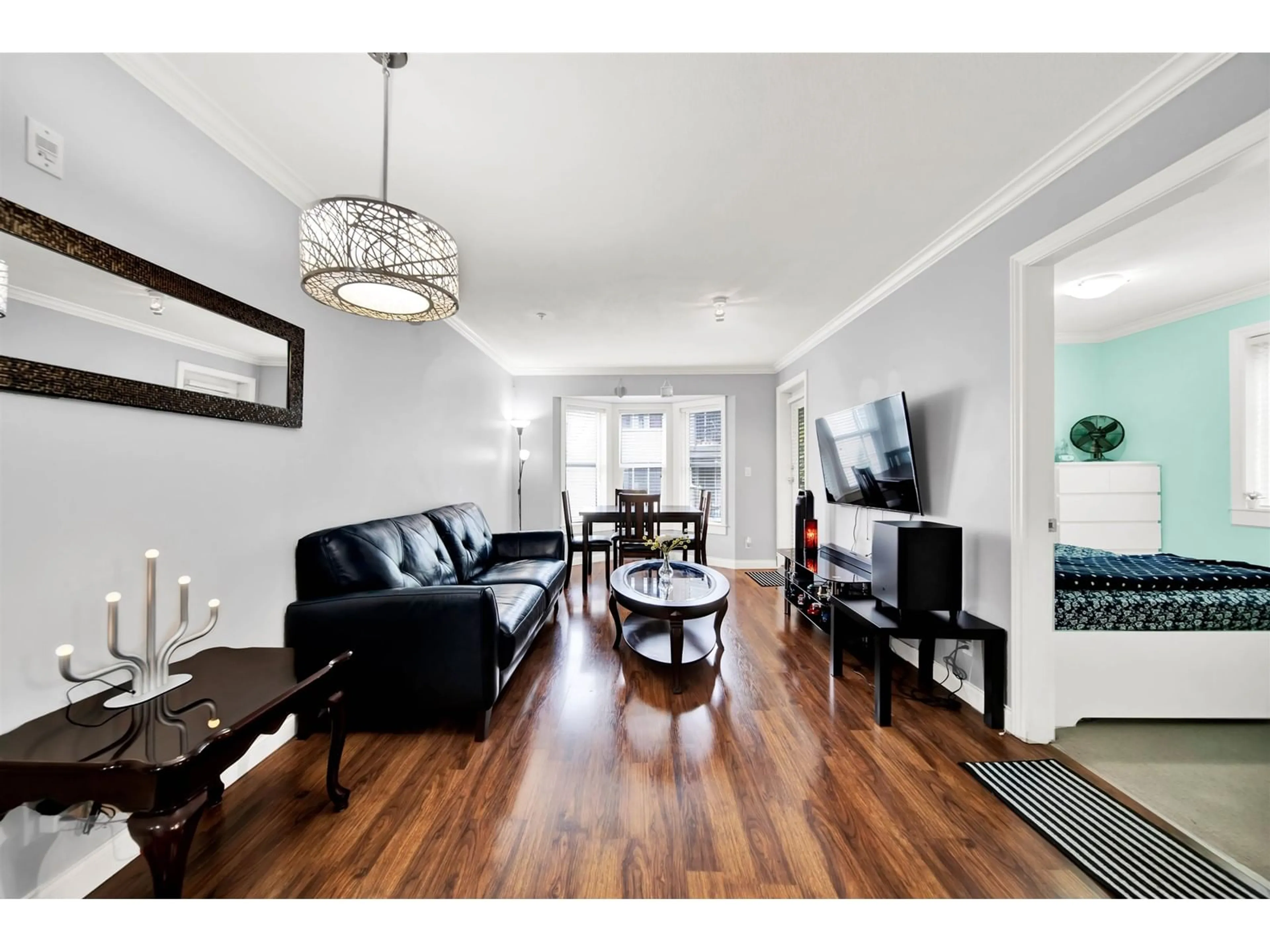 Living room with furniture, wood/laminate floor for 306 - 5474 198, Langley British Columbia V3A1G2