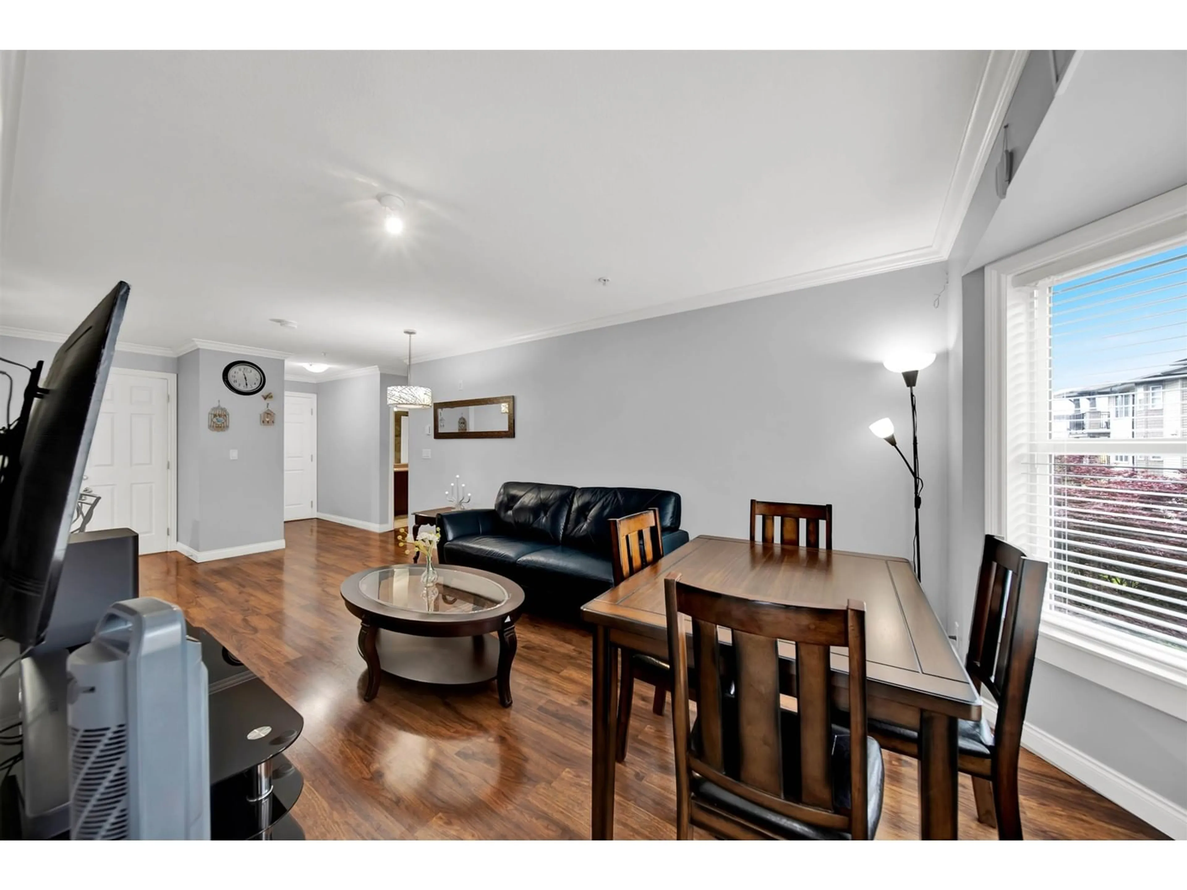 Living room with furniture, wood/laminate floor for 306 - 5474 198, Langley British Columbia V3A1G2