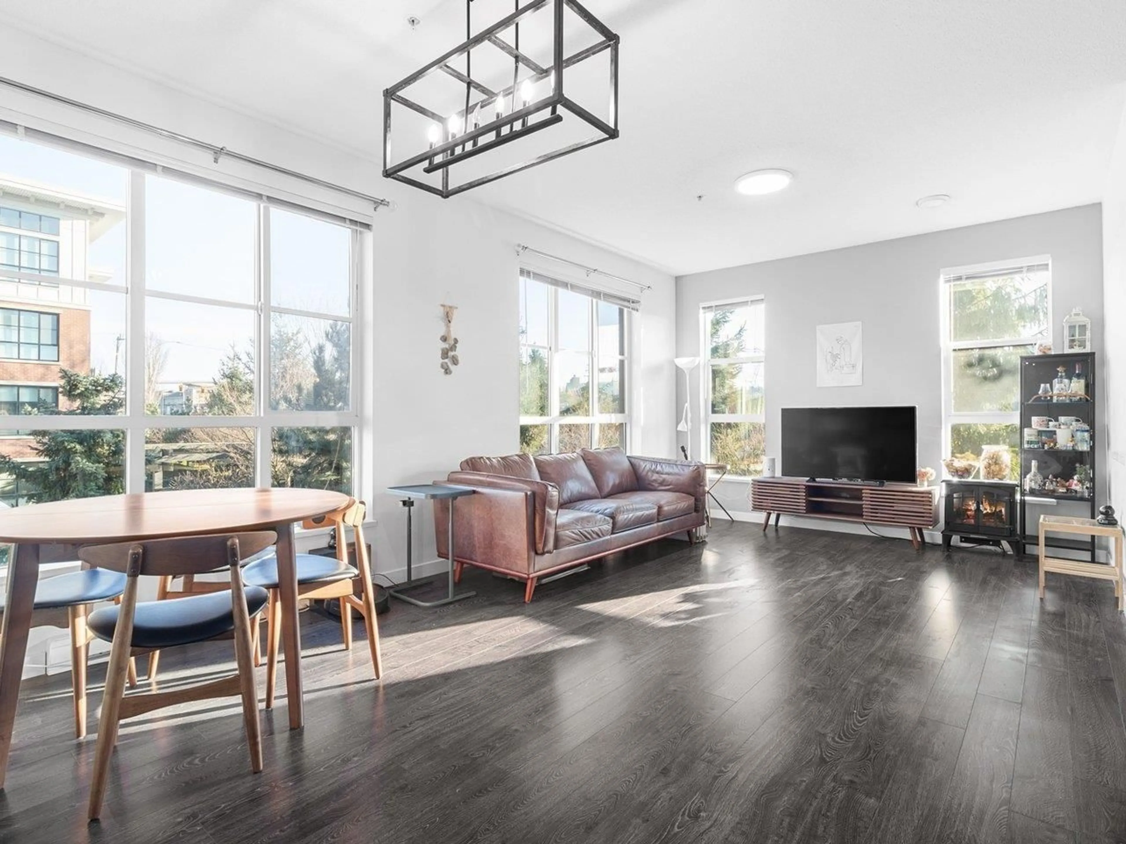 Living room with furniture, wood/laminate floor for 207 - 15168 33, Surrey British Columbia V3Z0N7